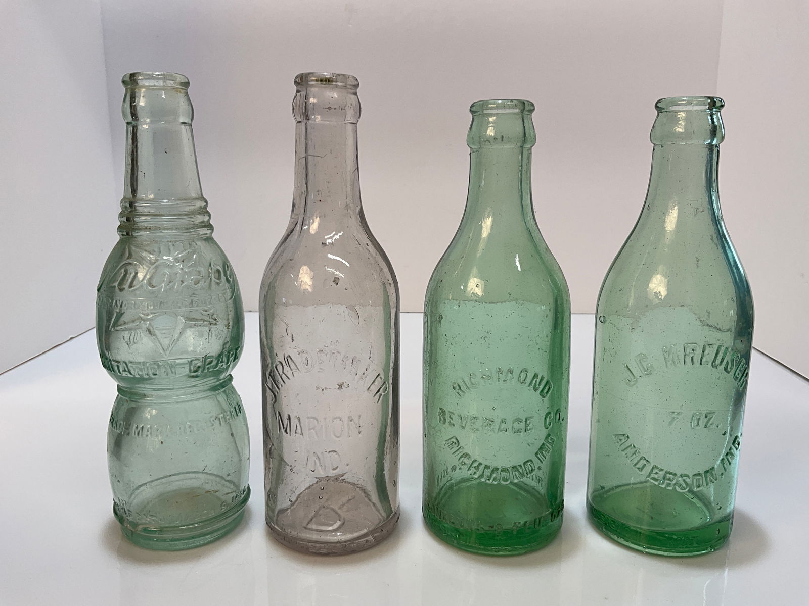 Lot of Four Art Deco Soda Pop Embossed Bottles, Richmond, Anderson, Marion, Muncie: Lot of Four Art Deco Soda Pop Embossed Bottles, Richmond Beverage Co. Richmond Indiana - Clean and no damage, J.C. Kreusch Anderson, Indiana - Clean and No damage, J.T. Rademaker Marion Indiana - Cela