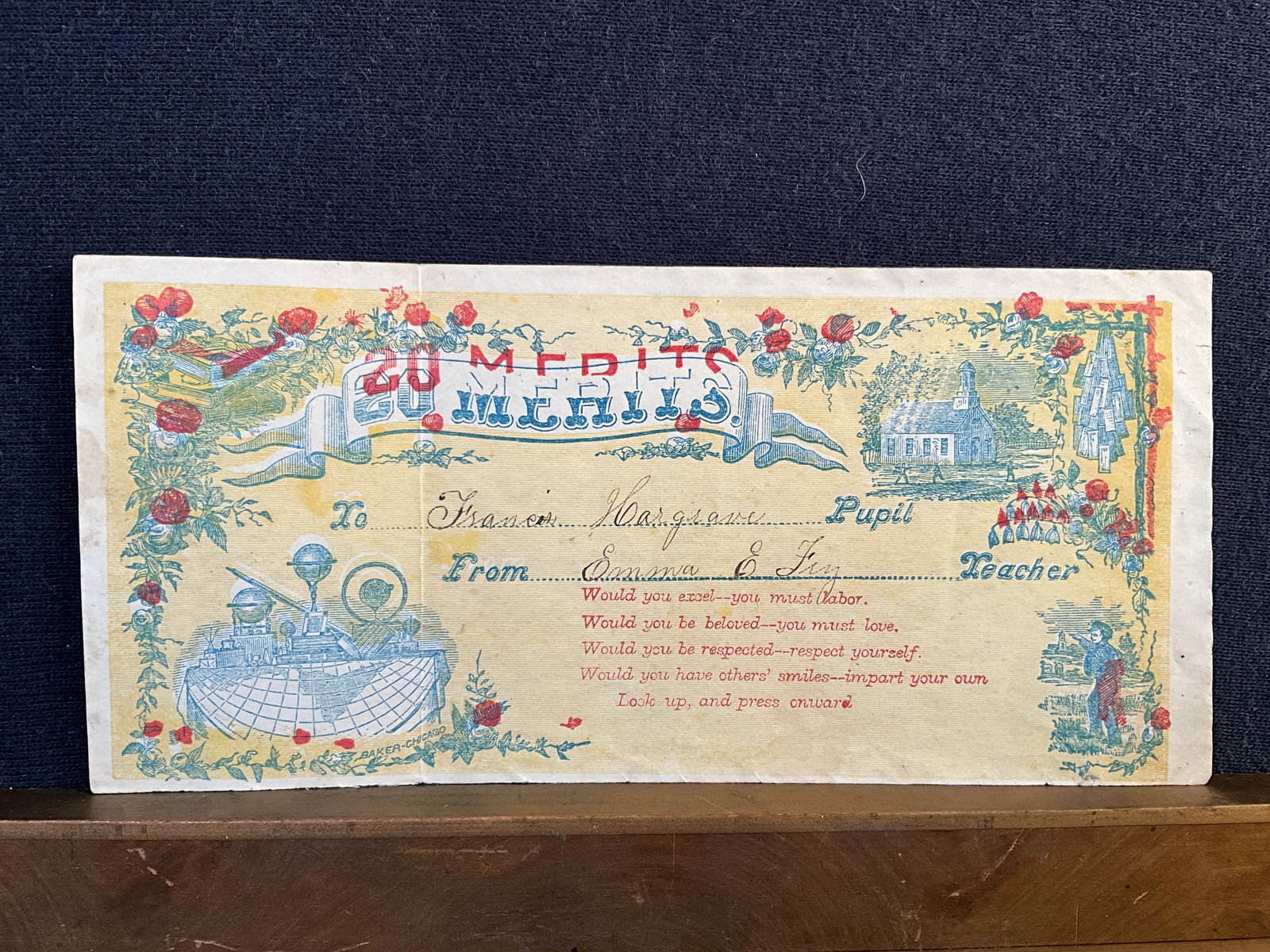 Rewards of Merit, ca. 1850s - Probably Printed With a Woodblock, and is Signed, “Baker-Chicago": This ca. late 1850s reward was probably printed with a woodblock, and is signed at the bottom “Baker-Chicago”. Filled with symbols of learning, it is 3 ¼” x 7”. All red high