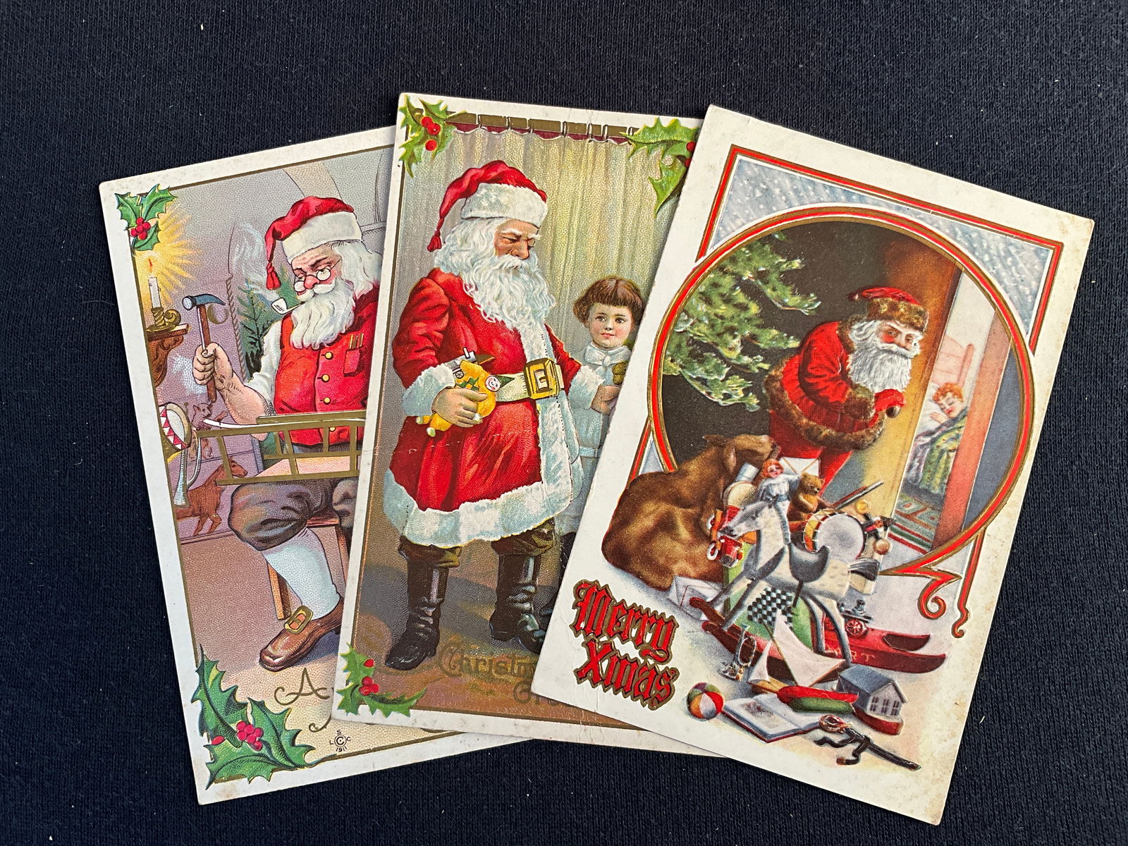 Post Cards, 1910, Lot of 3 - Santa Claus with toys Postcards: 3 cards of Santa with toys. Ca. 1910. Card with 2 girls has a creases.