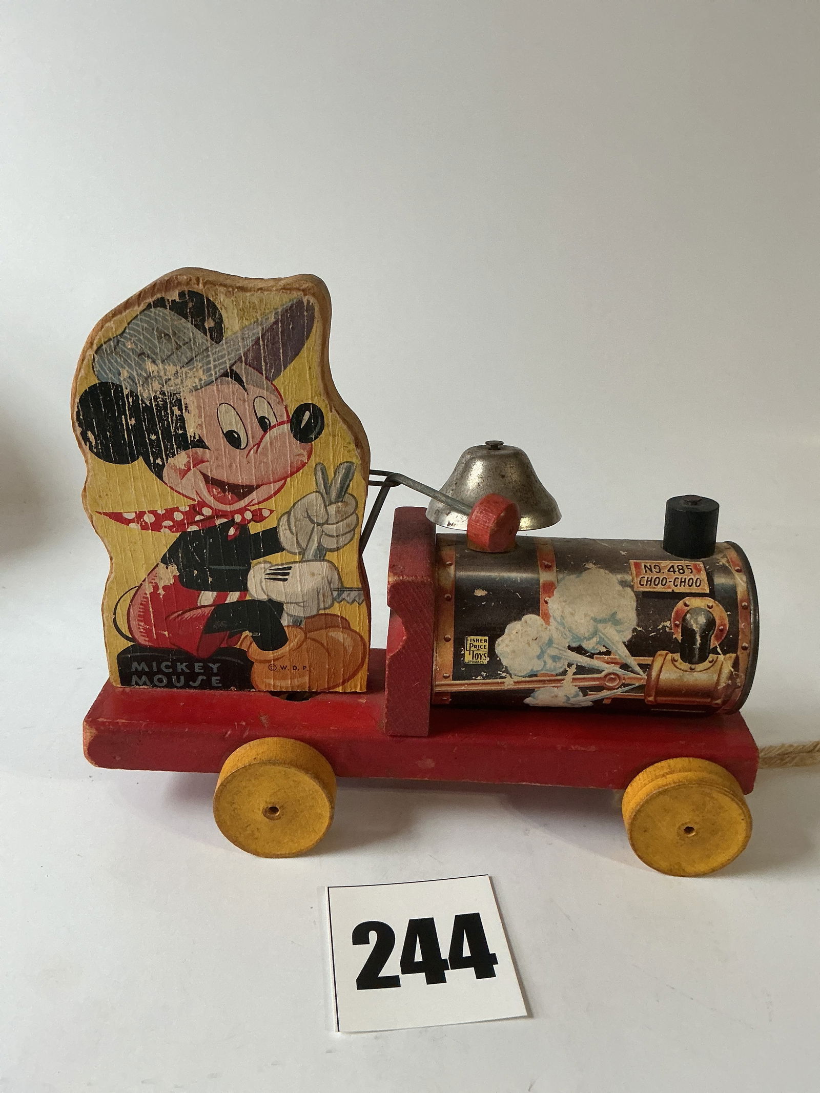 Early Mickey Mouse Pull Toy No. 485 Choo-Choo by Fisher Price Toys: Here's a Fisher Price Toys Mickey Mouse pull toy No. 485 Choo-Choo. This toy is ca. 1949 and was licensed by Walt Disney Production. The train is in good condition with just light wear from use. The g