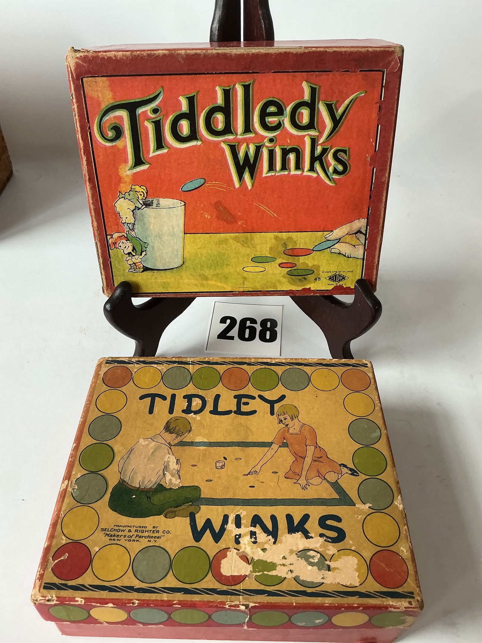 Lot of 2 Tiddledy Winks Games: Here are 2 great condition Tiddledy Winks games. One is spelled Tidley and the other is spelled Tiddledy. Both games appear to be complete.