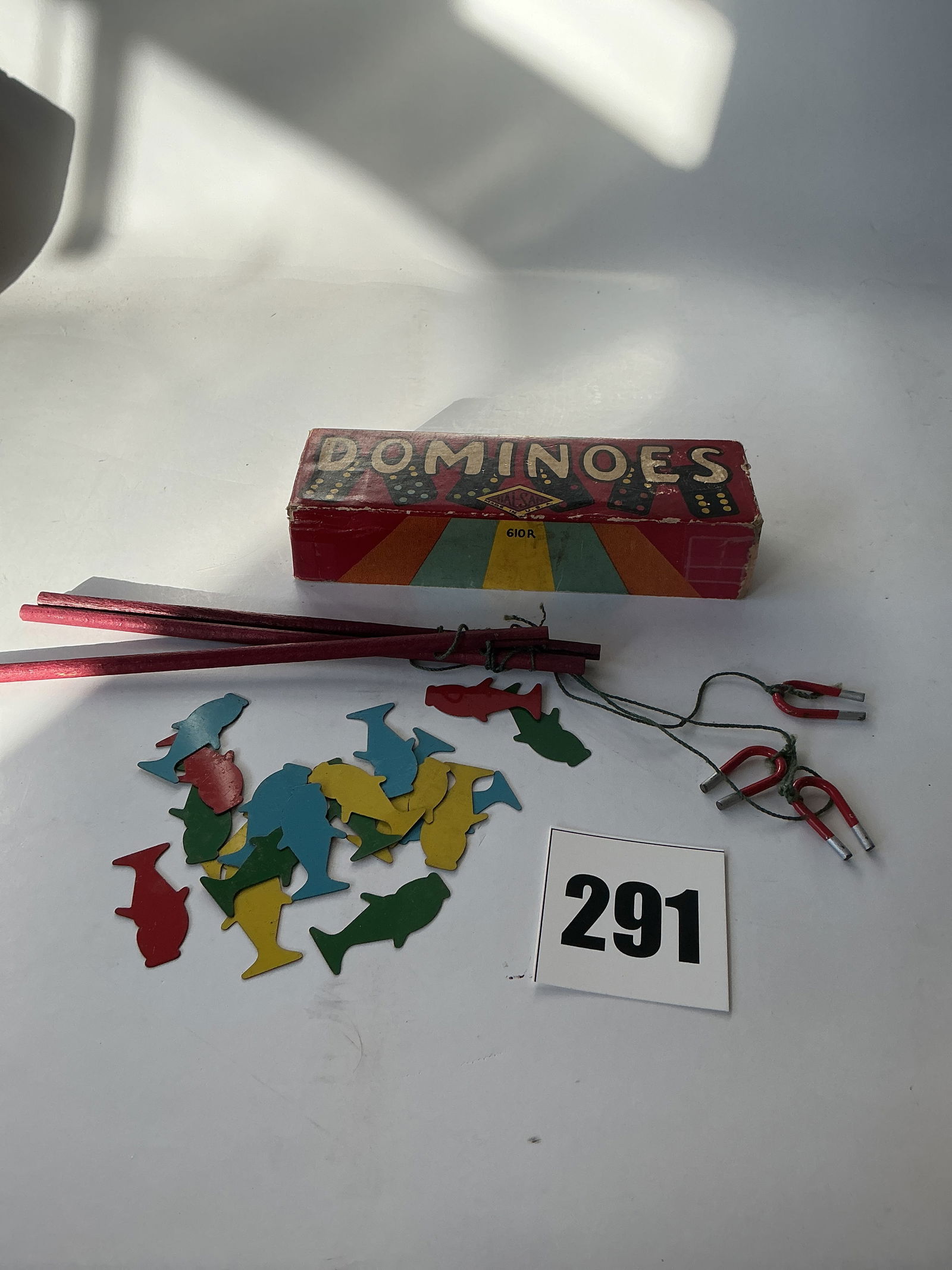 Lot of 2 Children's Games - Dominoes and a Magnetic Fishing Game: Here's a lot with 2 child's games. The first is an older box of Dominoes. It appears to be complete and in good condition. The second is a magnetic fishing game. It comes with 3 poles and 16 metal fis