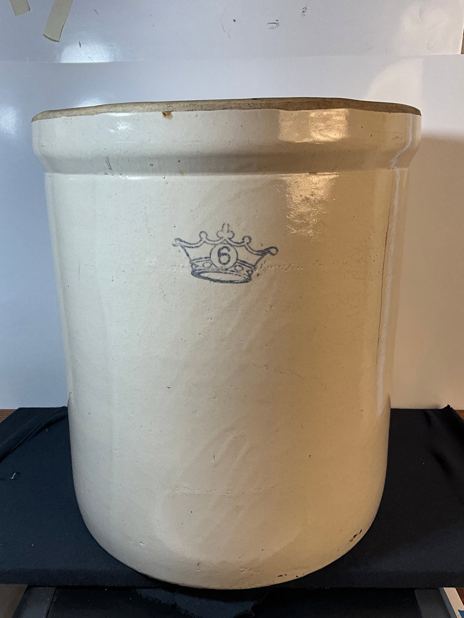 6 Gallon Blue Crown Stoneware, Robinson Ransbottom with Blue Crown: 6 Gallon Blue Crown Stoneware, Robinson Ransbottom with Blue Crown. White slip glaze that measures 14.5 inches tall by 12 3/4 in diameter. There is one crack in the piece that runs from the lip down a