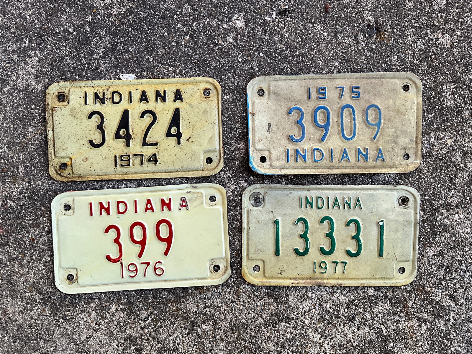 Lot of Four Indiana Motorcycle Plates, 1974, 1975, 1976, and 1977. (1 of 2)