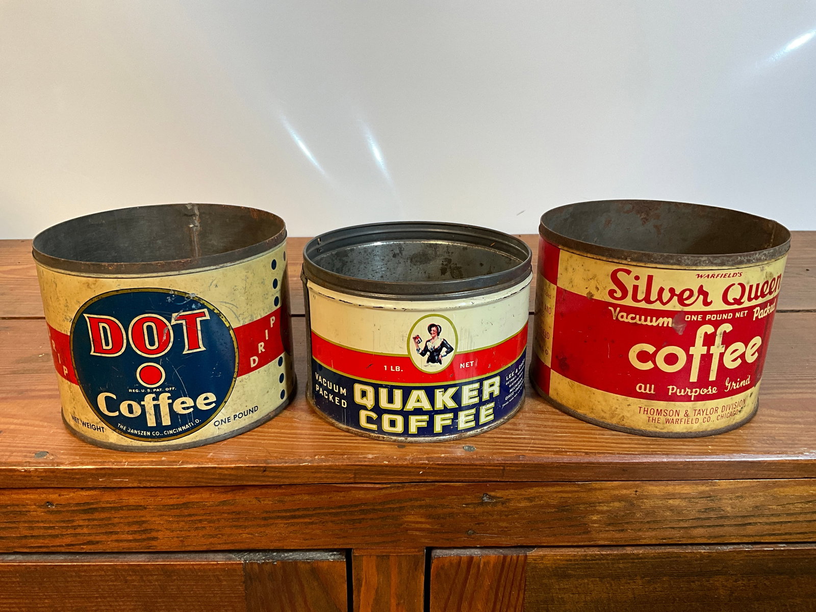 Lot of Three Vintage Coffee Tins, Dot Coffee, Quaker Coffee, and Silver Queen, All One-Pound: Lot of three vintage coffee tins. One is a Dot Coffee out of Cincinnati, Ohio. It is a one-pound tin and does not have a lid. The second coffee is a Quaker Coffee. It is one-pound and does not have a