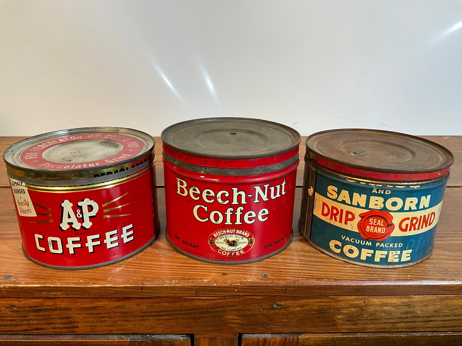 Lot of Three Vintage Coffee Tins, Chase and Sanborn, A&P, Beech-Nut, All One-Pound, All Have Lids: Lot of three vintage coffee tins. One is a Chase and Sanborn out of New York. It is a one-pound tin with a lid. The second coffee tin is an A&P Coffee tin out of New York. It is one-pound coffee tin w