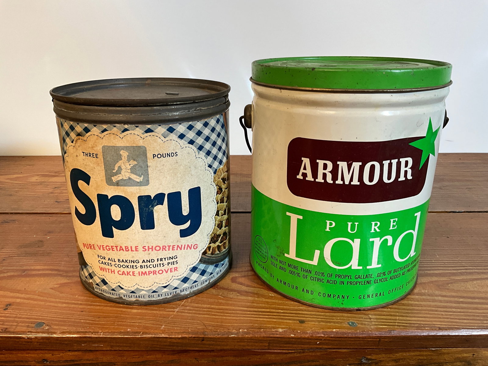 Lot of Two Vintage Tin Cans, Spry Pure Vegetable Shortening, Armour Pure Lard: Lot of two empty shortening/lard cans. Spry Pure Vegetable Shortening out of New York. This can has a paper label. This is a three pound can with lid. The second can is an Armour Pure Lard out of Chic