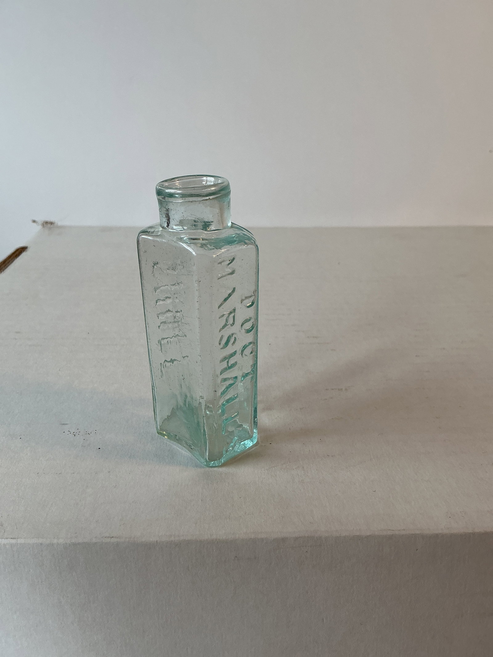 Doct Marshall's Snuff, Open Pontil: Here we have a Doct Marshall's Snuff, clear or light aqua color, rolled lip and open pontil. The bottle stands a little over 3 inches tall and has no damage or stain. Glass has some nice whittle.