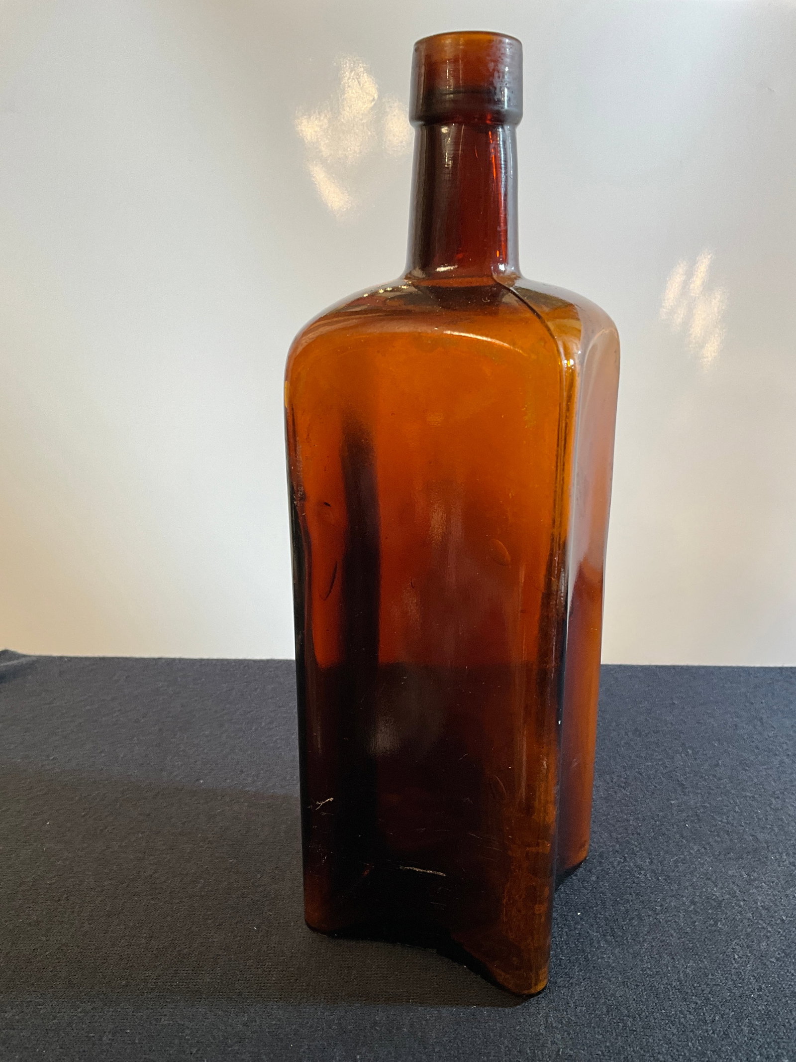 The Vigor Bitter & Tonic Co. Bitters Bottle with Concave Panels, Amber, Tooled Top (1 of 5)