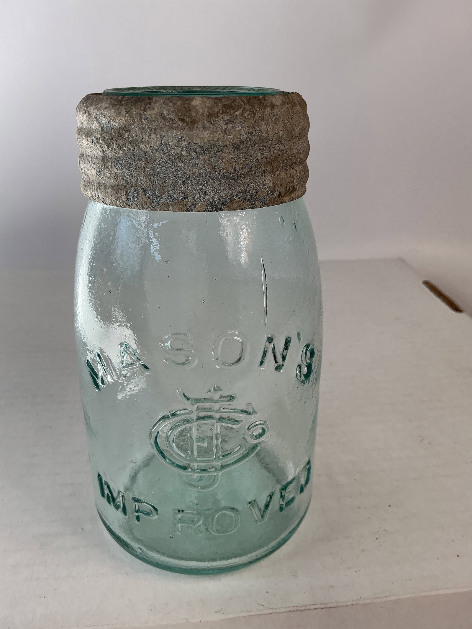 Midget Mason Jar - Mason's CFJ Improved: Here's another Mason's CFJ Improved. This jar is aqua in color, has correct insert and band and has no damage or stain.
