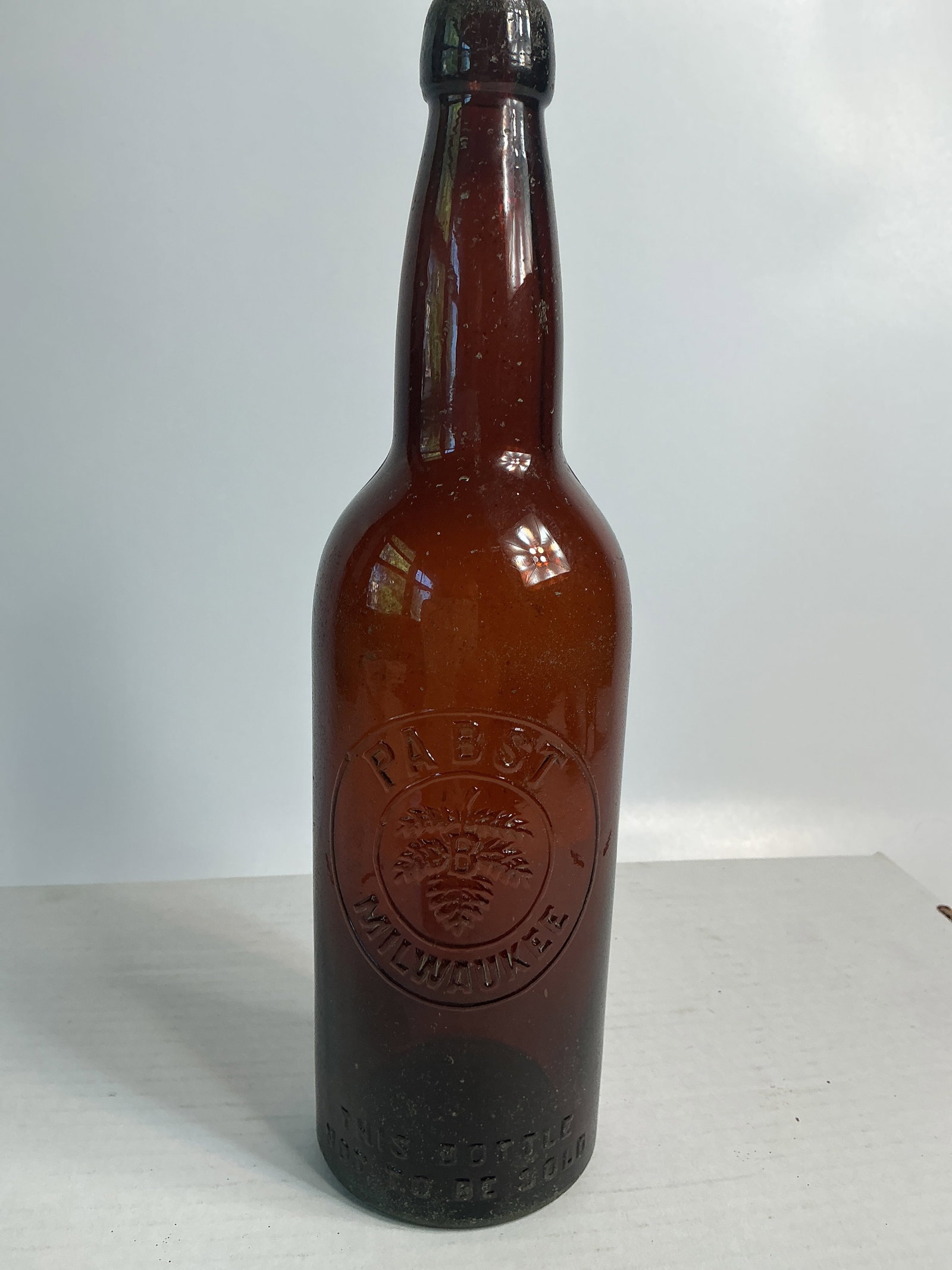 Quart Pabst Milwaukee Amber Bottle w/ Applied Lightning Blob: Here's a nice quart amber beer embossed Pabst Milwaukee with the trademark. It also has an applied lightning blob and is in great condition. There is a small amount of case wear near the base. W.F.&