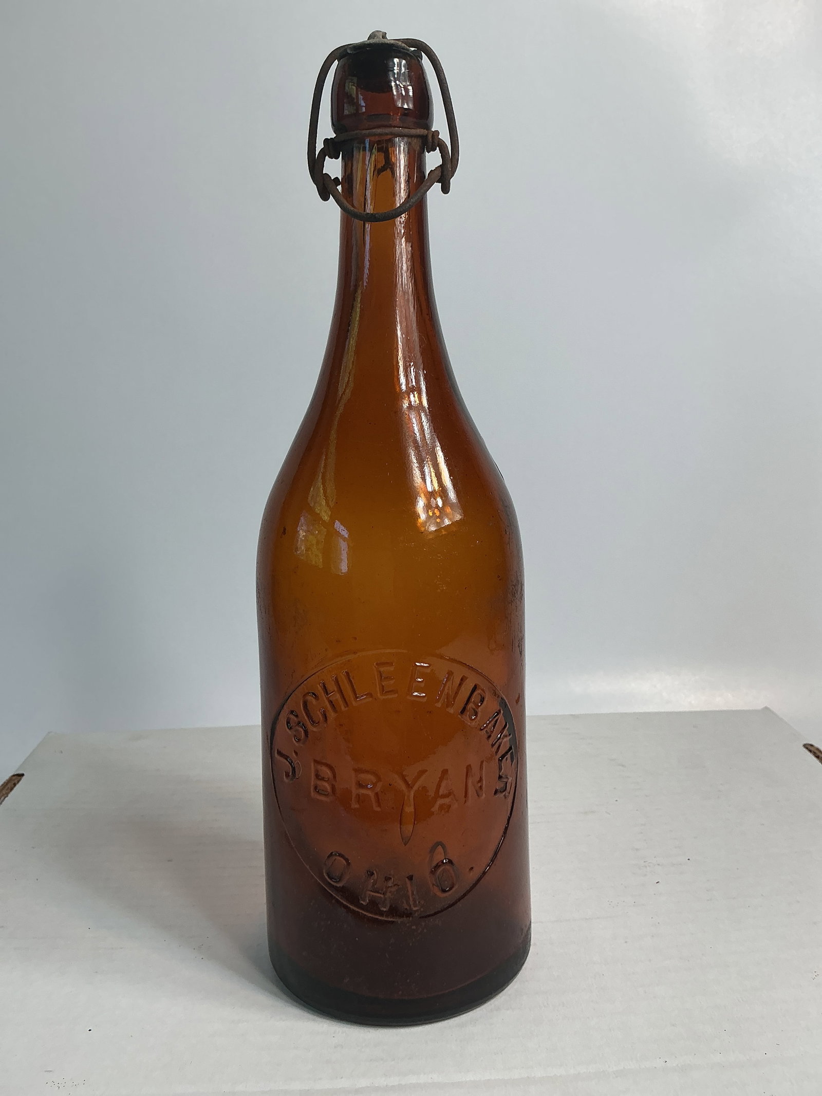 Quart Amber Beer - J. Schleenbaker Bryan, Ohio, Lightning Blob w/ Bail: Here's a nice quart amber beer embossed J. Schleenbaker Bryan, Ohio.It has an applied lightning blob w/ bail and no damage. There is some light residue on the interior that should wash out. Could be
