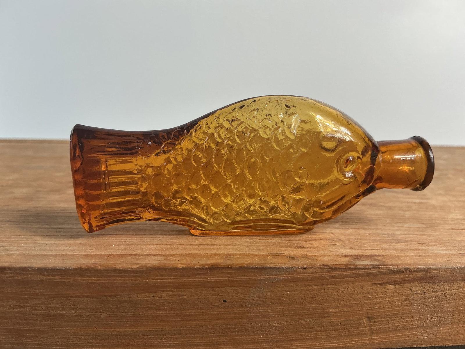 Rare Eli Lilly Sample Cod Liver Oil Fish Bottle, 3" tall, Yellow Amber.: Here's a super hard to find Eli Lilly Sample Cod Liver Oil Fish Bottle. The little fish stands just 3" tall, is yellow amber in color and is in great condition. There is a tiny rough spot on the lip.