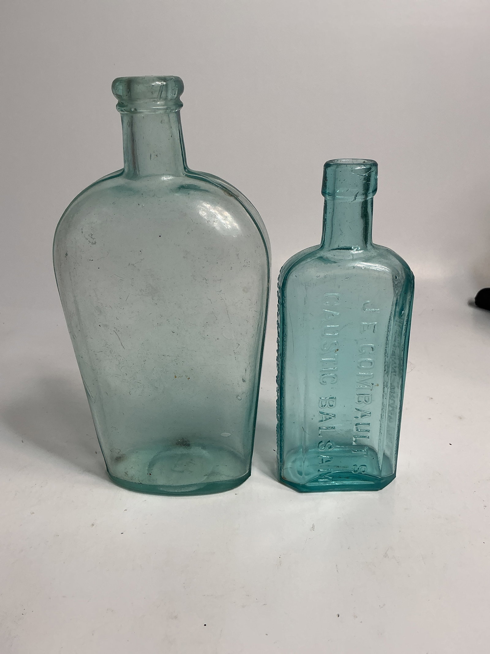 Lot of 2 Aqua Bottles - Gombault's Caustic Balsam & an Unembossed Pint Flask (1 of 4)