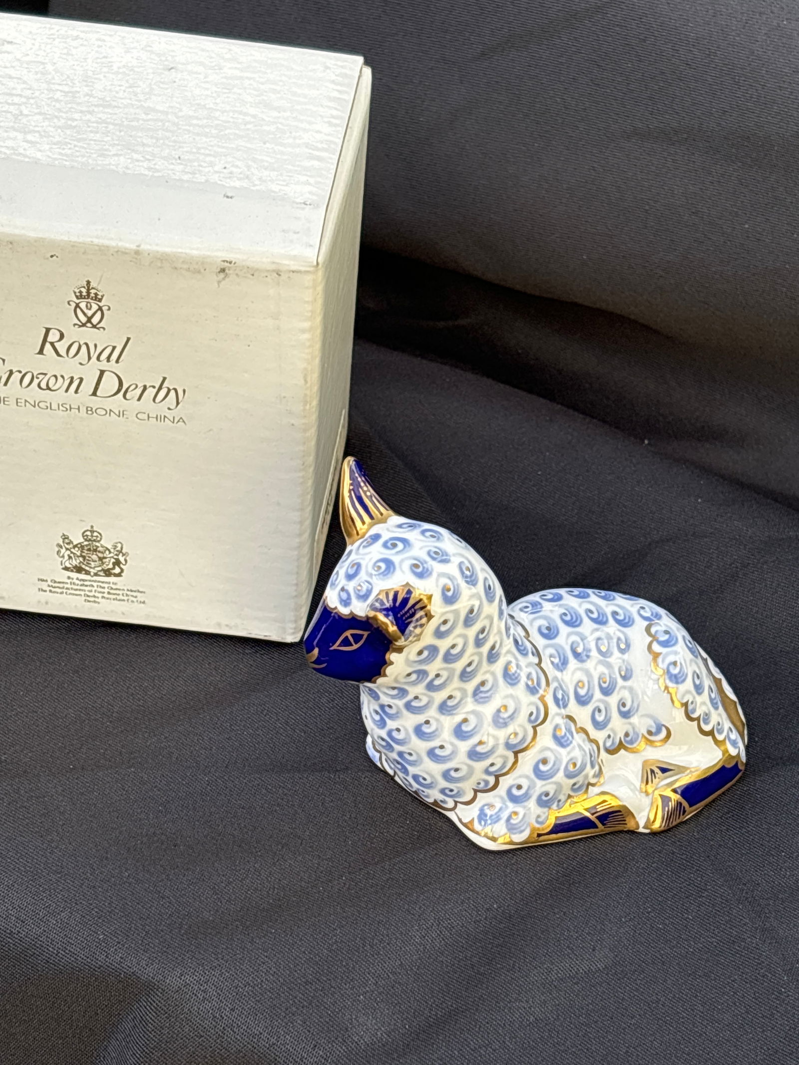 Vintage little lamb Royal Crown Derby fine china 2x3 inch paperweight in box: Vintage lamb Royal Crown Derby 2x3 inch paperweight. In original white box. Like new , good condition. Silvers topper.