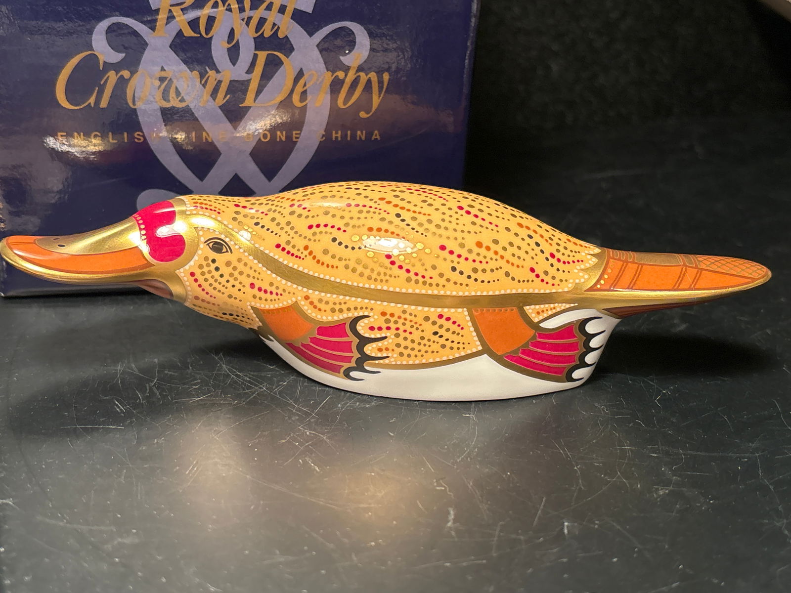 Artist signed 1999 Australian collection Duck billed platypus Royal Crown Derby 7in. paperweight: Artist signed 1999 Australian collection Duck billed platypus Royal Crown Derby 7in. paperweight. Gold stopper. In original box.Like new. Very good condition.