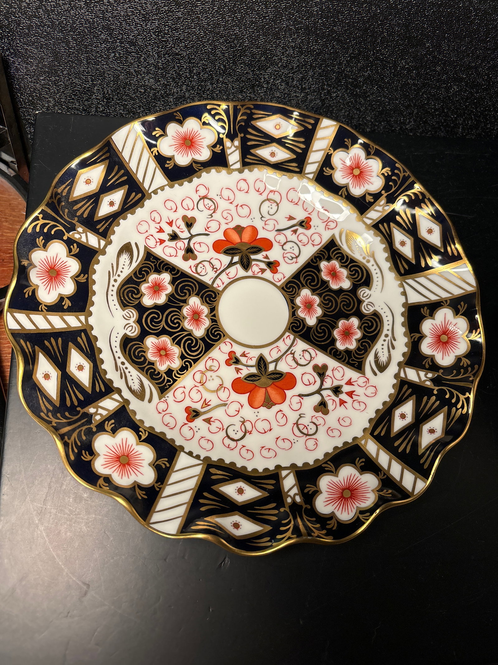 Wavy edge 2451 pattern Imari 8&1/2 inch Royal Crown Derby English bone china plate: Wavy edge Imari 8&1/2 inch Royal Crown Derby English bone china plate. gold enamel Hand painted in England. Very good condition.