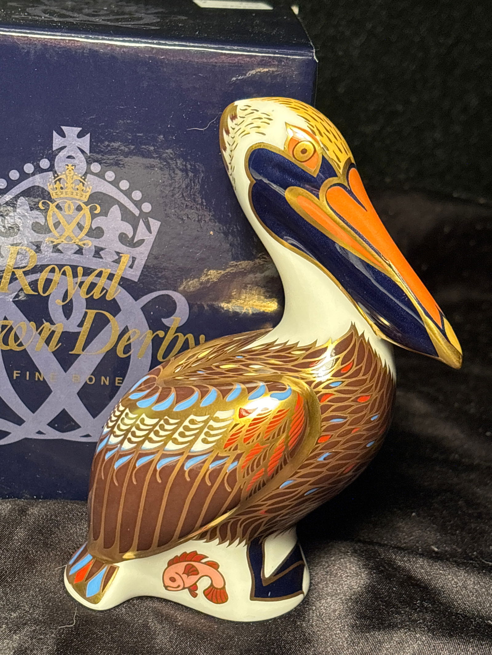 1988 Imari Brown Pelican 5 inch Royal Crown Derby bone china paperweight: Imari Brown Pelican Royal Crown Derby bone china paperweight in box. 5 inches. Gold stopper. Hand painted.Very good condition.