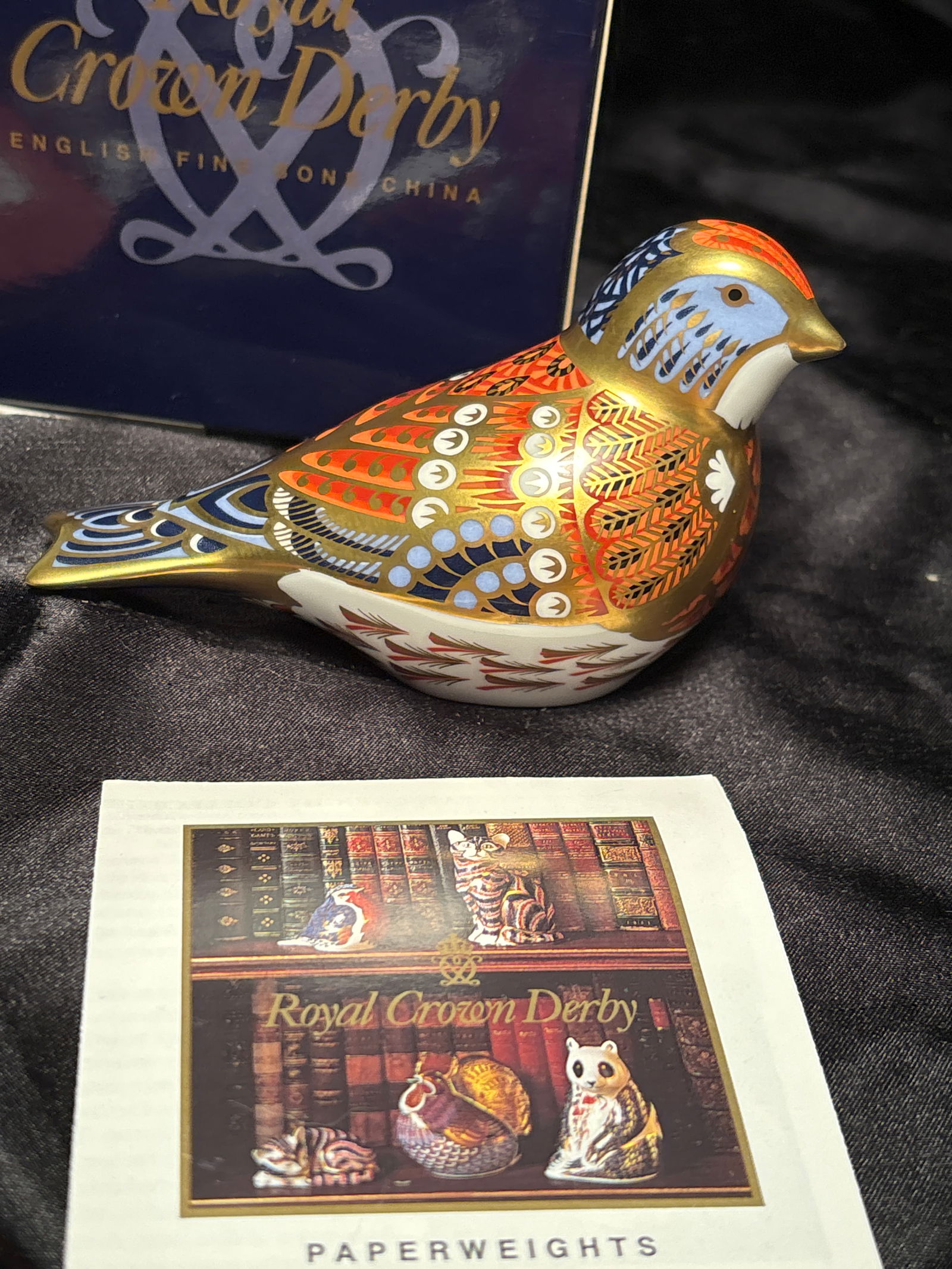 2001 Exclusive Imari Linnet Royal Crown Derby bone china 3&3/4 inch paperweight in box: Linnet bird Royal Crown Derby bone china paperweight in box. Gold stopper.Very good estate condition.