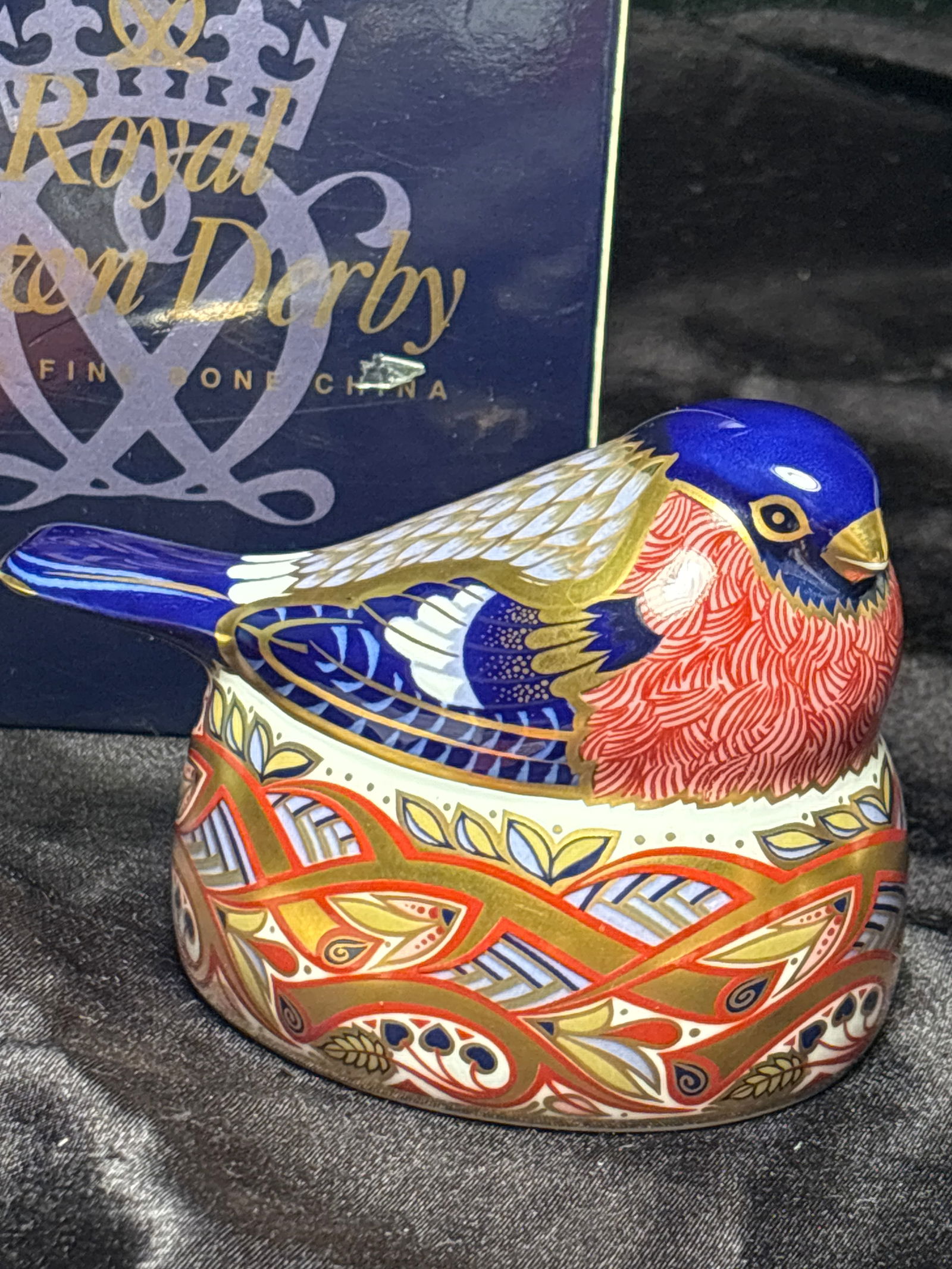 1996 Bullfinch Nesting Royal Crown Derby bone china 3&3/4 inch paperweight in box: Nesting Bullfinch Royal Crown Derby bone china paperweight in box. Silver stopper.Very good estate condition.