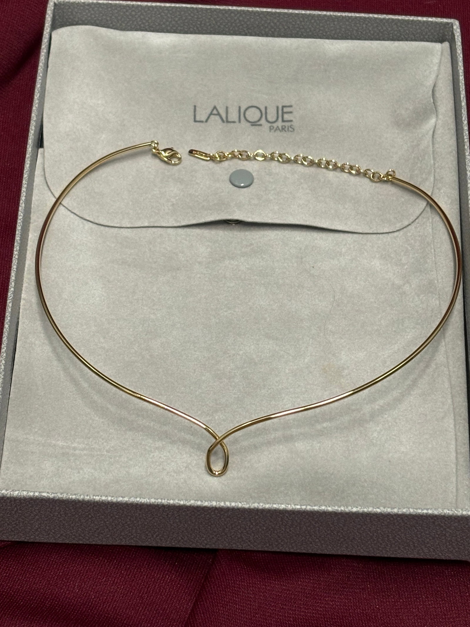 Original signed Lalique gold plated metal 10” necklace in original box: Original signed Lalique gold plated metal 10” necklace in original box; box has wear. Metal tag plaque impressed marked Lalique.Very good condition.