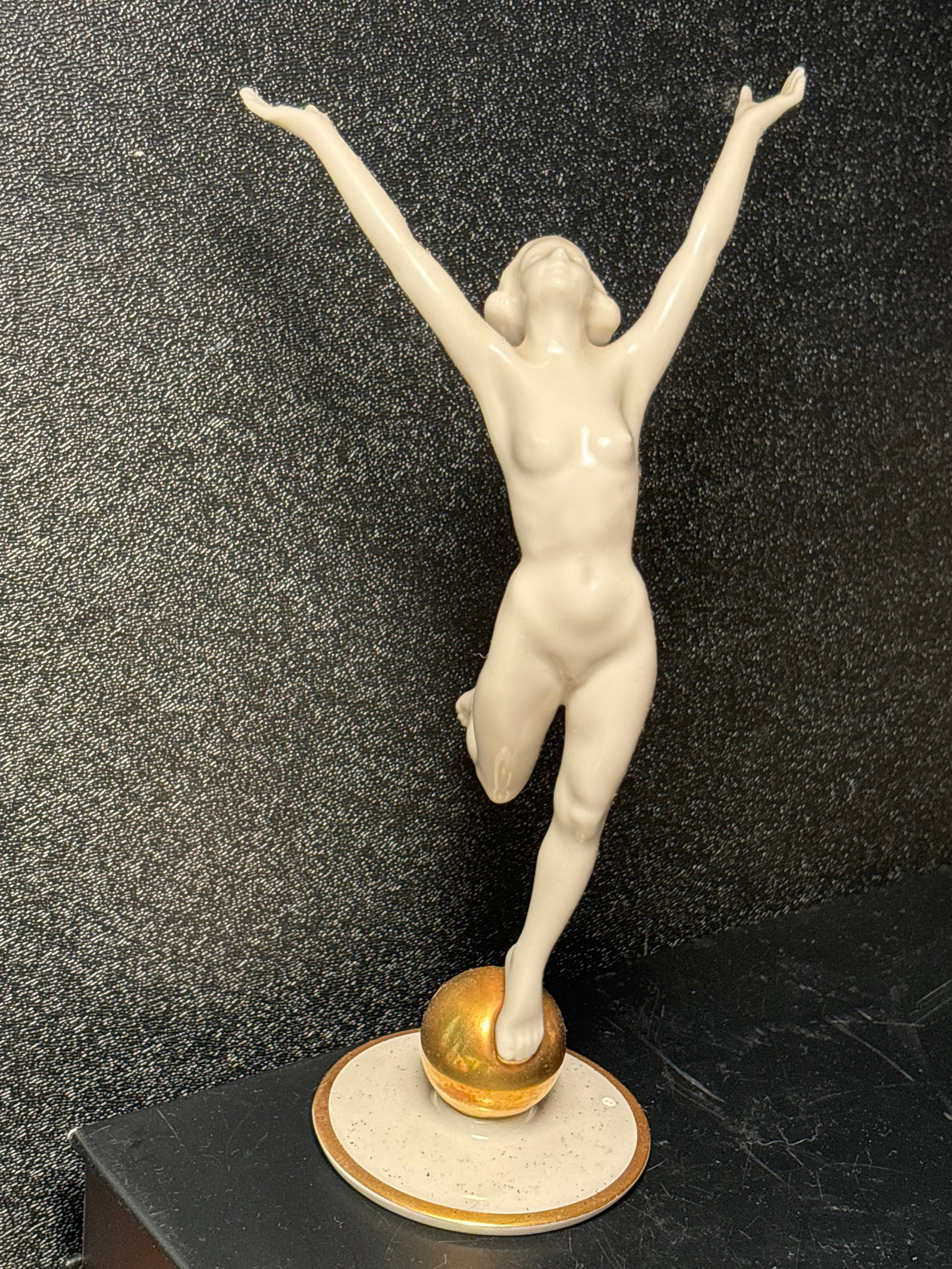 9 inch tall nude on gold ball Hutschenreuther Germany statue: 9 inch tall nude on gold ball Hutschenreuther Germany statue. White glazed porcelain with gold enamel decoration.Good clean estate condition