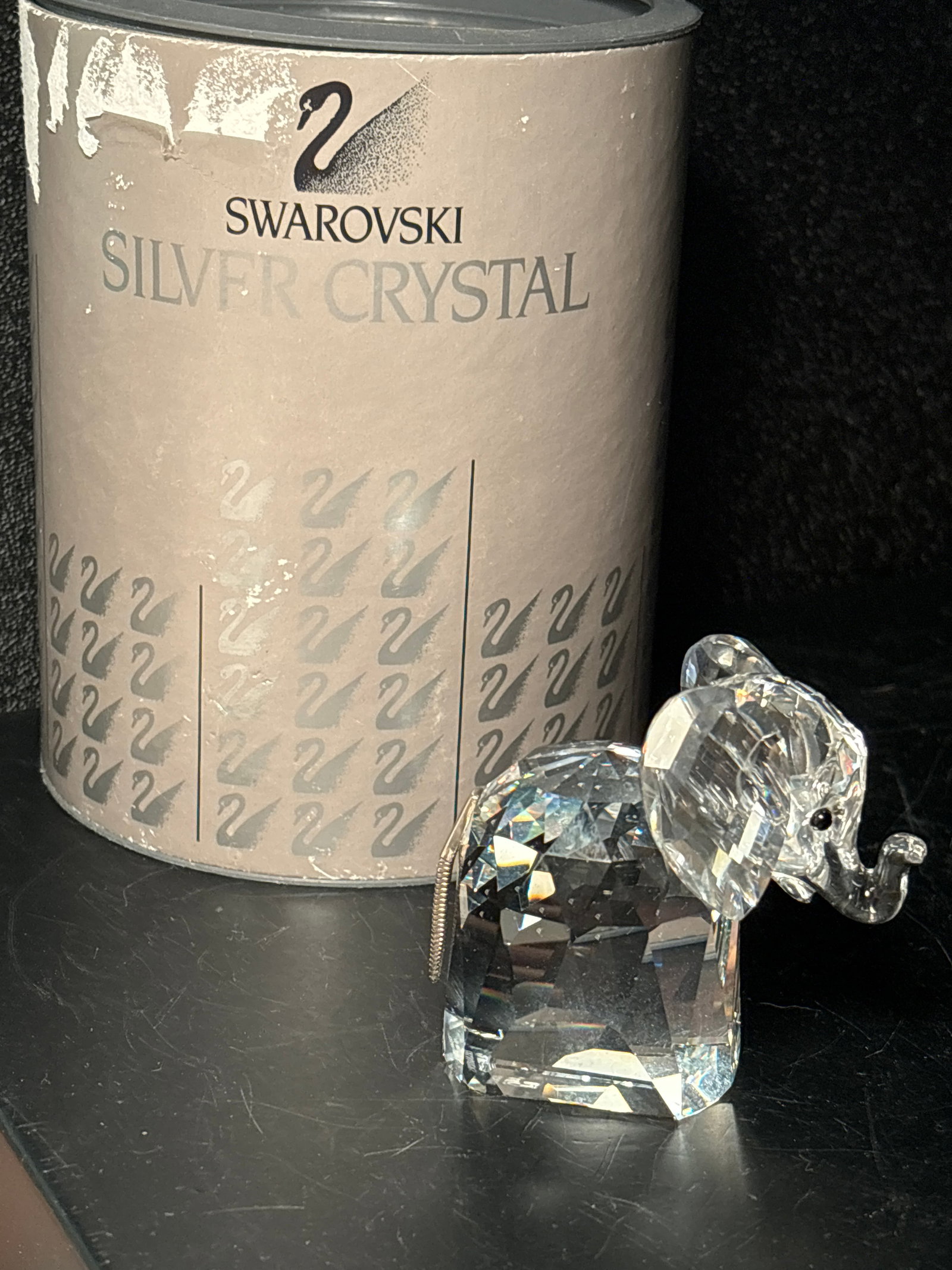 Vintage Swarovski Austrian cut crystal 2&1/2 inch elephant w/metal tail: Vintage Swarovski Austrian cut crystal 2&1/2 inch elephant statue in box. Measures 2 1/2“ x 2 1/2”.Signed on bottom.Good condition with no damage.