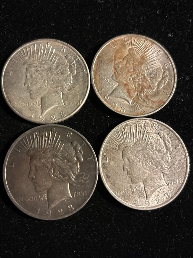 lot of four circulated silver 1923 Peace dollars (1 of 6)