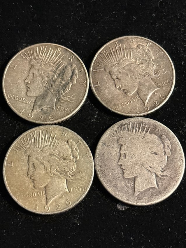 Group of four (4) 1926 Peace silver dollars; one date illegible (1 of 6)