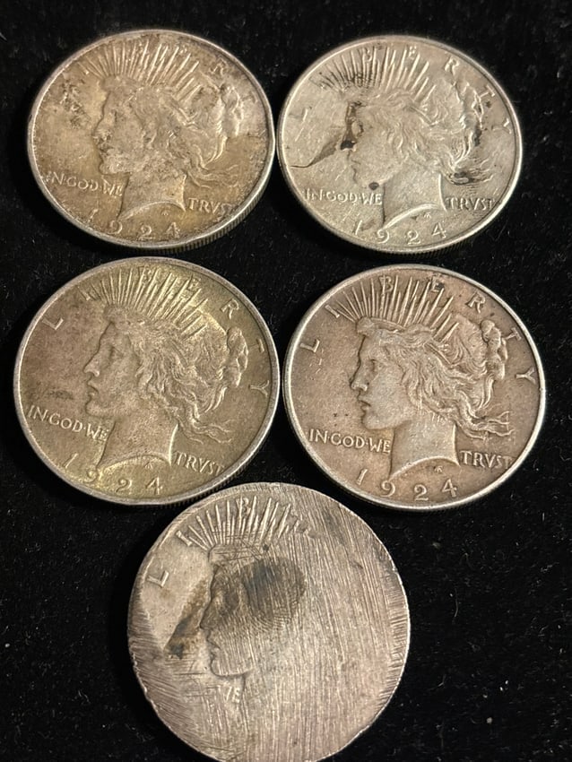 Group of five (5) 1924 Peace silver dollars; one date illegible (1 of 7)