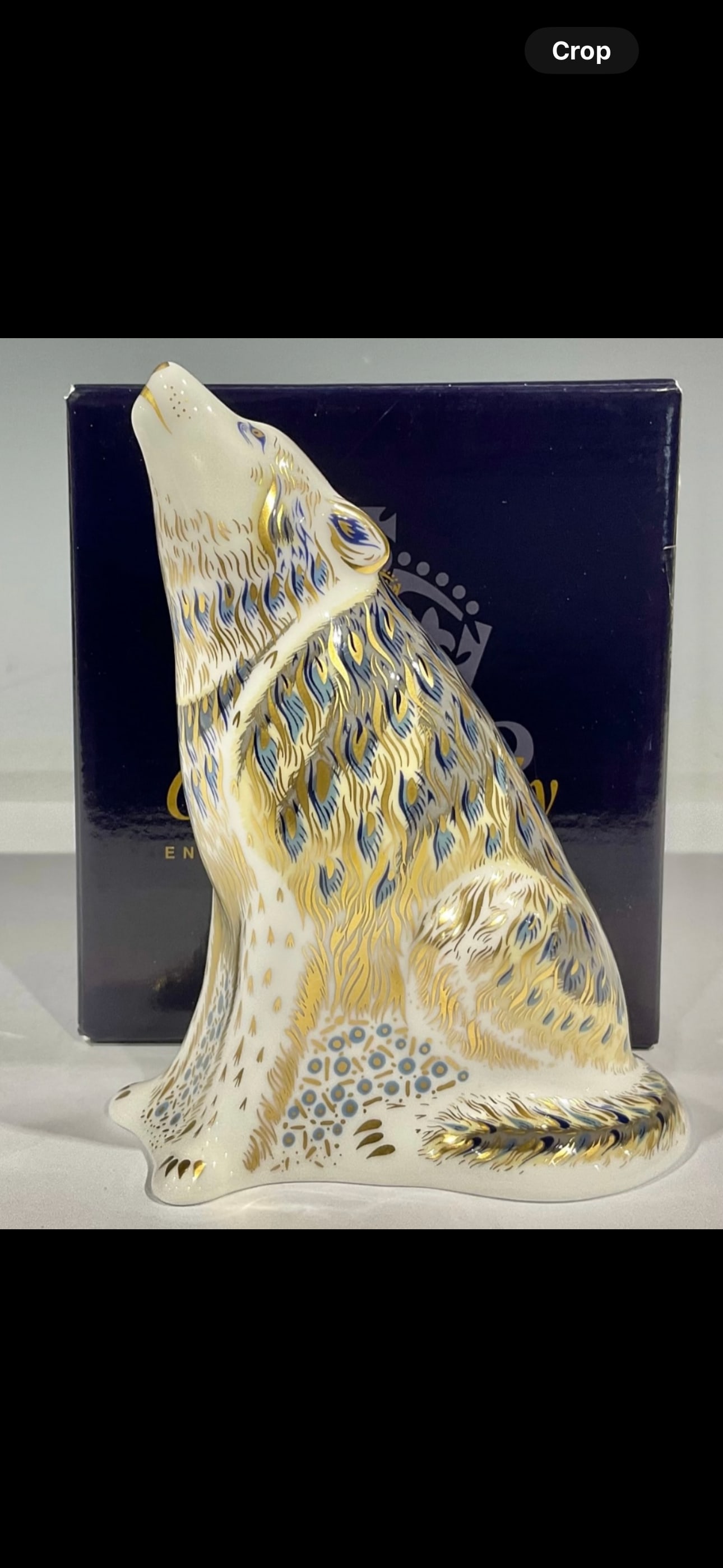 English bone china 5&1/4 Royal Crown Derby paperweight, Wolf artist signed limited Ed.: A Royal Crown Derby paperweight, Wolf, a signature limited edition of 2,500, hand signed and dated in gold by designer Tien Manh Dinh, gold stopper, 13cm, printed marks, boxed.Like new condition