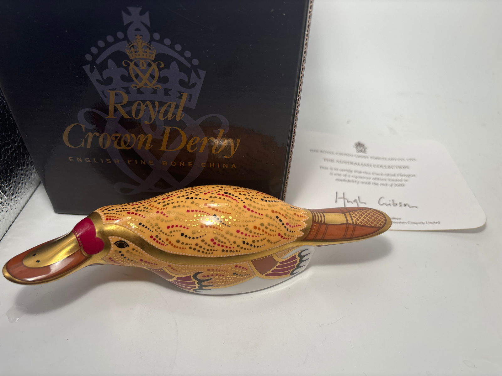 1999Australian collection 6&1/2inch Royal Crown Derby Platypus fine English china paperweight statue: Artist signed 1999 Australian Collection Duck-billed Platypus Royal Crown Derby fine English china paperweight statue. Limited edition. All hand painted. Gold stopper. Original box. 6&1/2 inches long.
