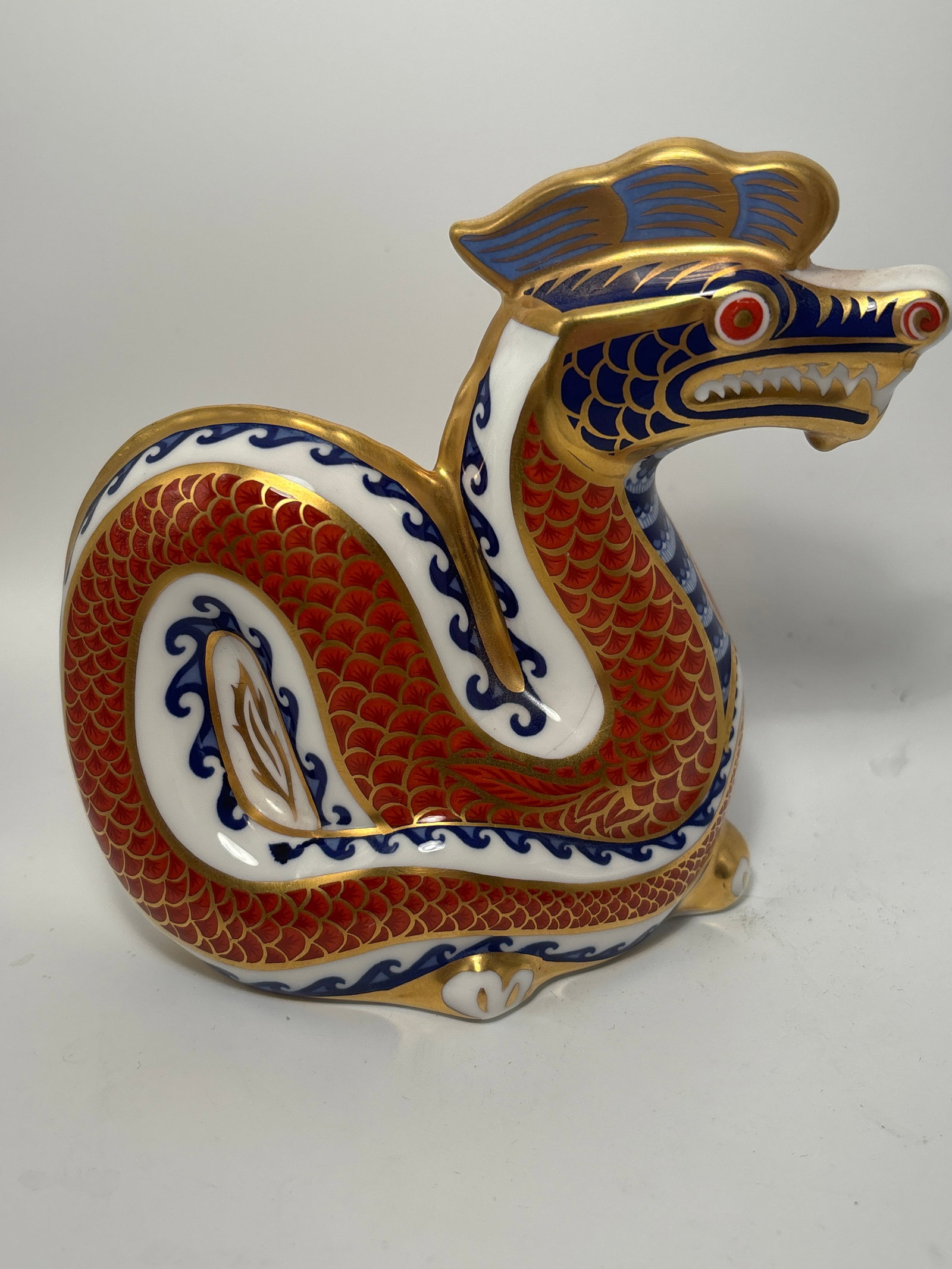 Royal Crown Derby Imari Dragon English china 5inch paperweight statue: Royal Crown Derby Imari Dragon fine English china paperweight.on opposing pierced through design. No box. All hand painted.Very good condition. No chips or cracks and the gold is in great condition.
