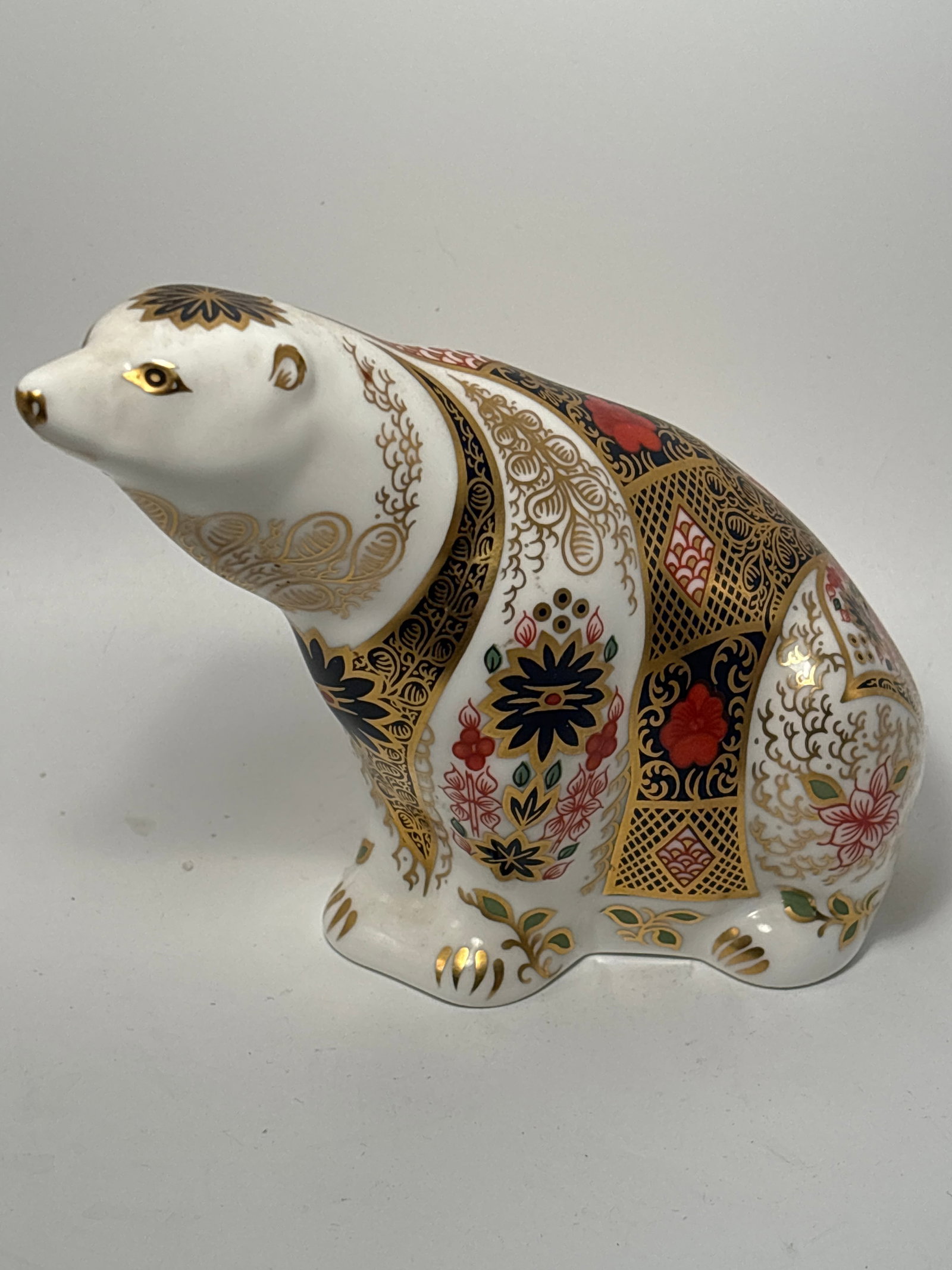 5 inch Imari Polar Bear Royal Crown Derby English china 6 inch paperweight statue: Royal Crown Derby Imari polar bear fine English china paperweight.on opposing pierced through design. No box. All hand painted.Very good condition. No chips or cracks and the gold is in great conditio