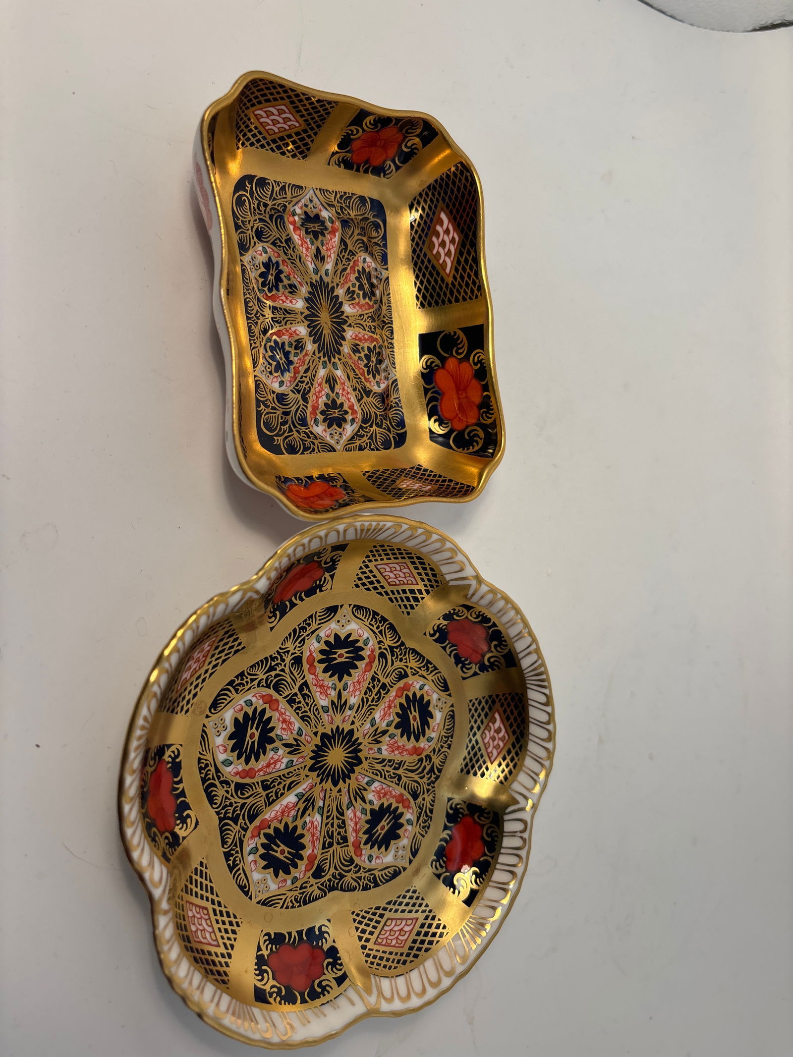 2 Olde Imari gold band pattern 1128 Royal Crown Derby English china dishes: Two Imari pattern 1128 Royal Crown Derby English china dishes. Clover shape is 4&1/2”. Other is 3”c 3&1/4”.Very good beautiful condition