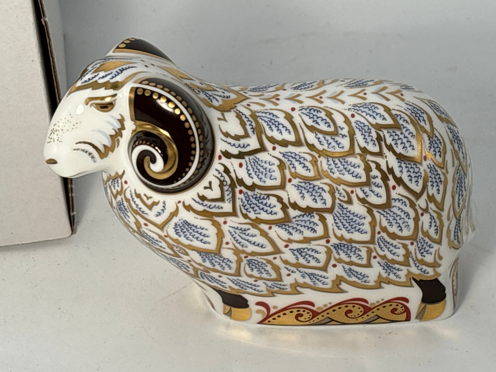 2007 limited edition Premier Ram Royal Crown Derby England 4&3/4 inch paperweight statue: “One of a Time Limited Edition Exclusive…”.2007 limited edition Wolf Royal Crown Derby England 4&3/4 inch paperweight statue. Nice glazed body with all over hand enameled gold accents. Origi
