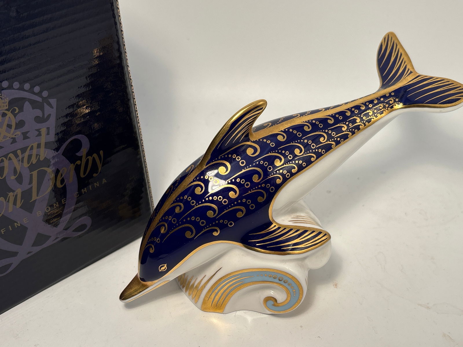 Lyme Bay Dolphin Royal Crown Derby English 7inch paperweight: Lyme Bay Dolphin Royal Crown Derby English 7&1/3inch Paperweight statue. Silver Stopper. Original box.Very good beautiful condition