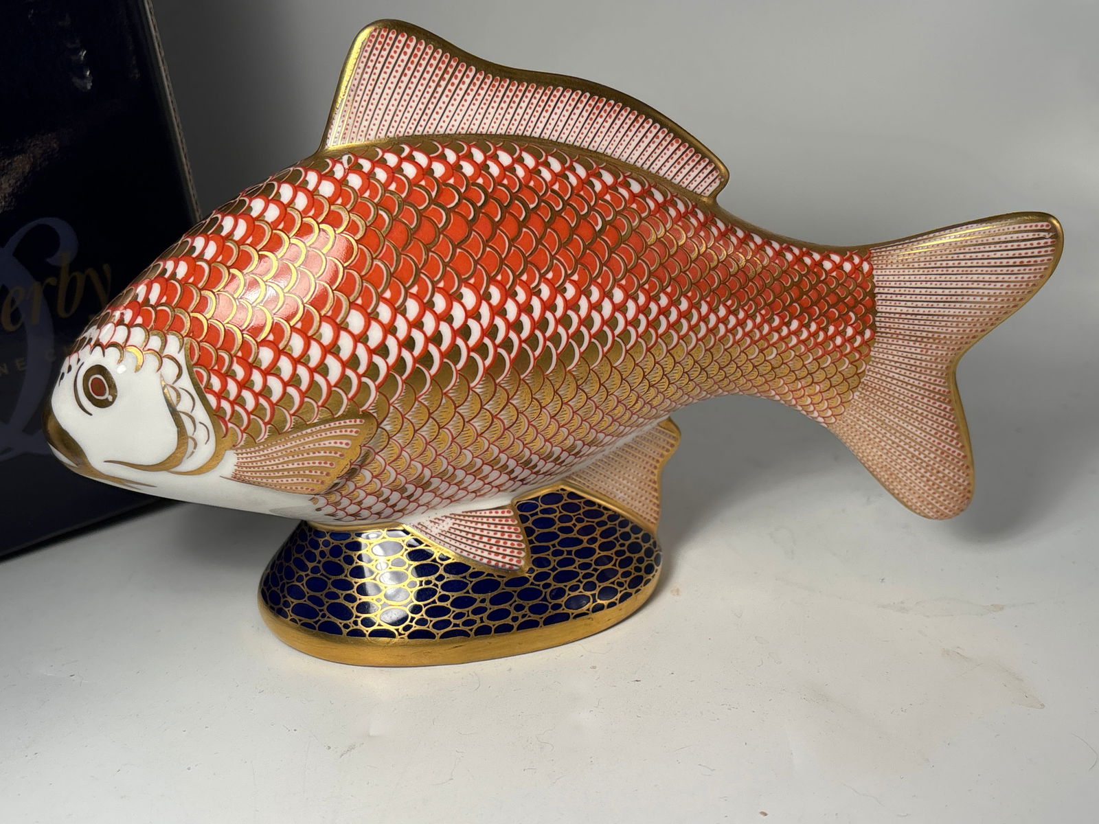 Large 7 inch Koi carp fish form Royal Crown Derby paperweight: Large 7 inch Koi carp fish form Royal Crown Derby paperweight . With box. Silver stopper.Very good condition, no chips, cracks, etc.