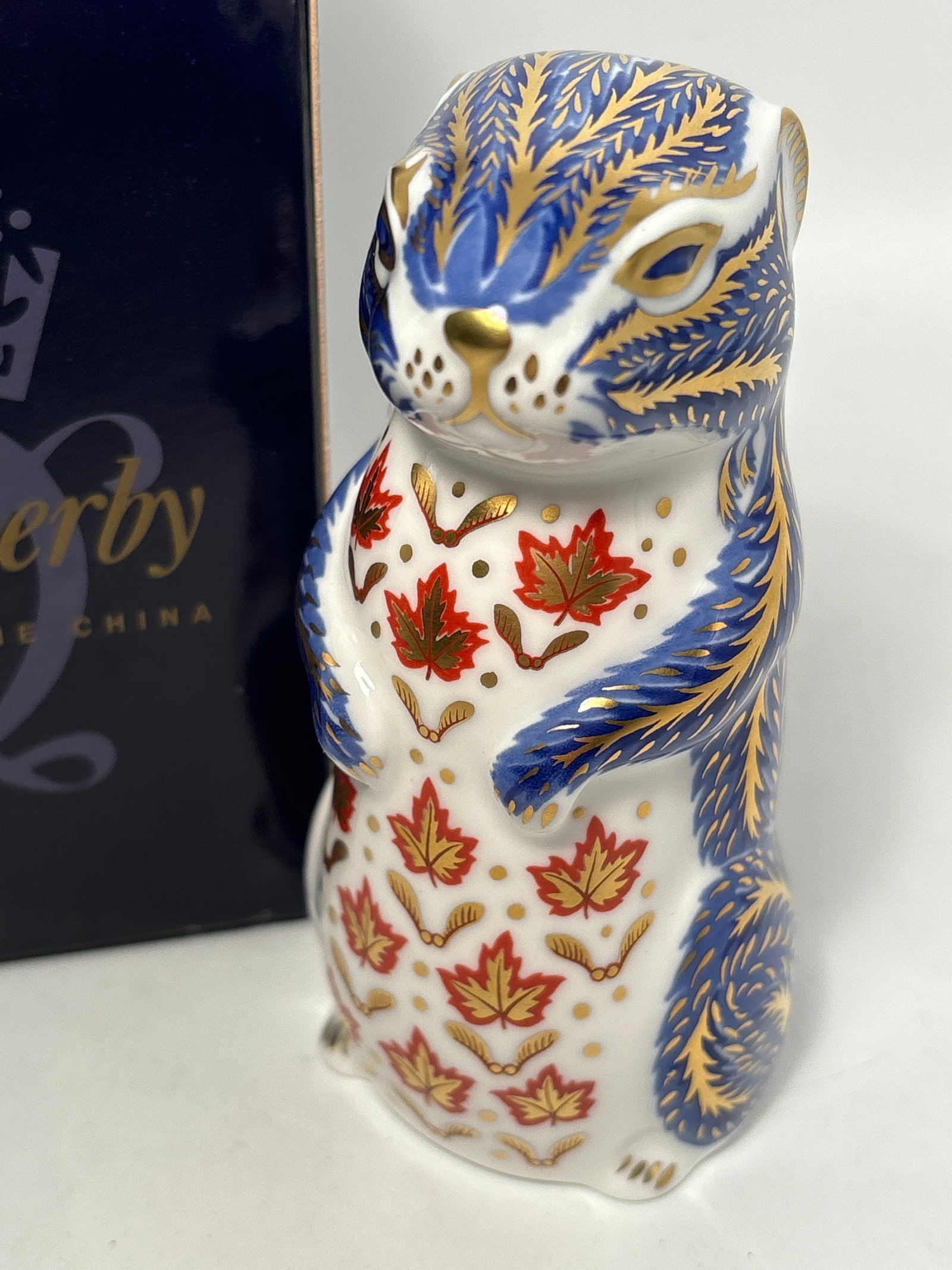 Chipmunk Royal Crown Derby 4&1/2 inch paperweight statue: Chipmunk Royal Crown Derby 4&1/2 inch paperweight statue. Original box. Silver stopper.Very good condition, no chips, cracks, etc.
