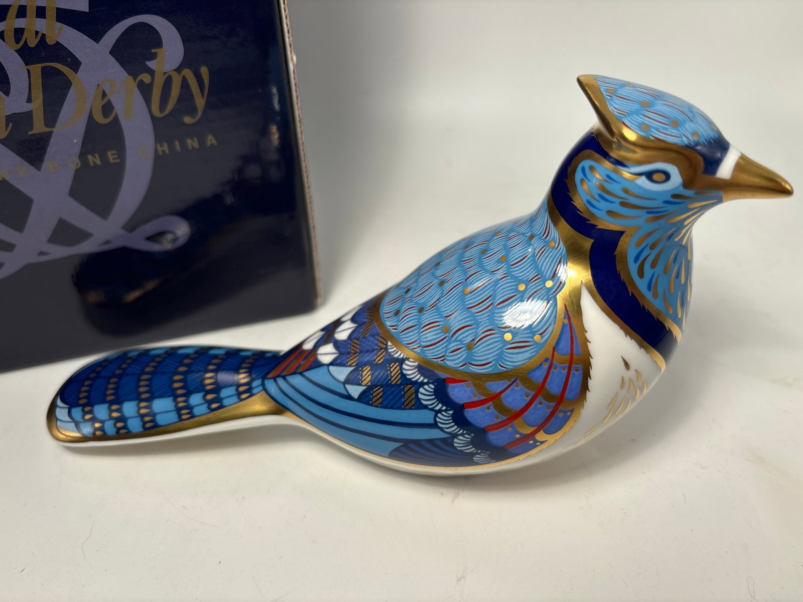 Large Blue Jay Royal Crown Derby 7 inch paperweight statue: Blue JayRoyal Crown Derby 7 inch paperweight statue. Original box. Silver stopper.Very good condition, no chips, cracks, etc.