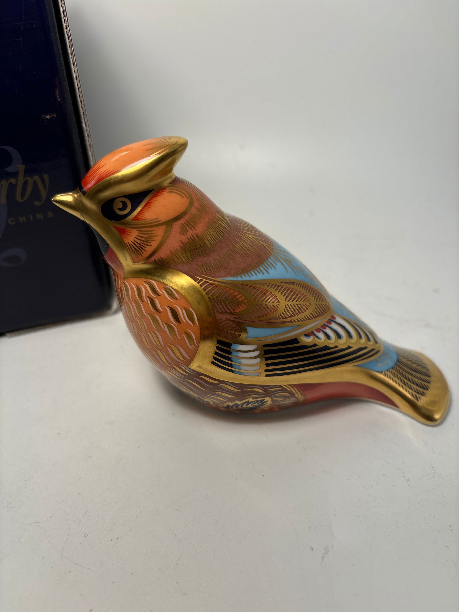 2005 Sinclair’s edition ‘Bohemian Waxwing’ Royal Crown Derby 5inch paperweight statue: Sinclair’s “Bohemian Waxwing” Crown Derby 5 inch paperweight statue. Original box. Gold stopper.Very good condition, no chips, cracks, etc.
