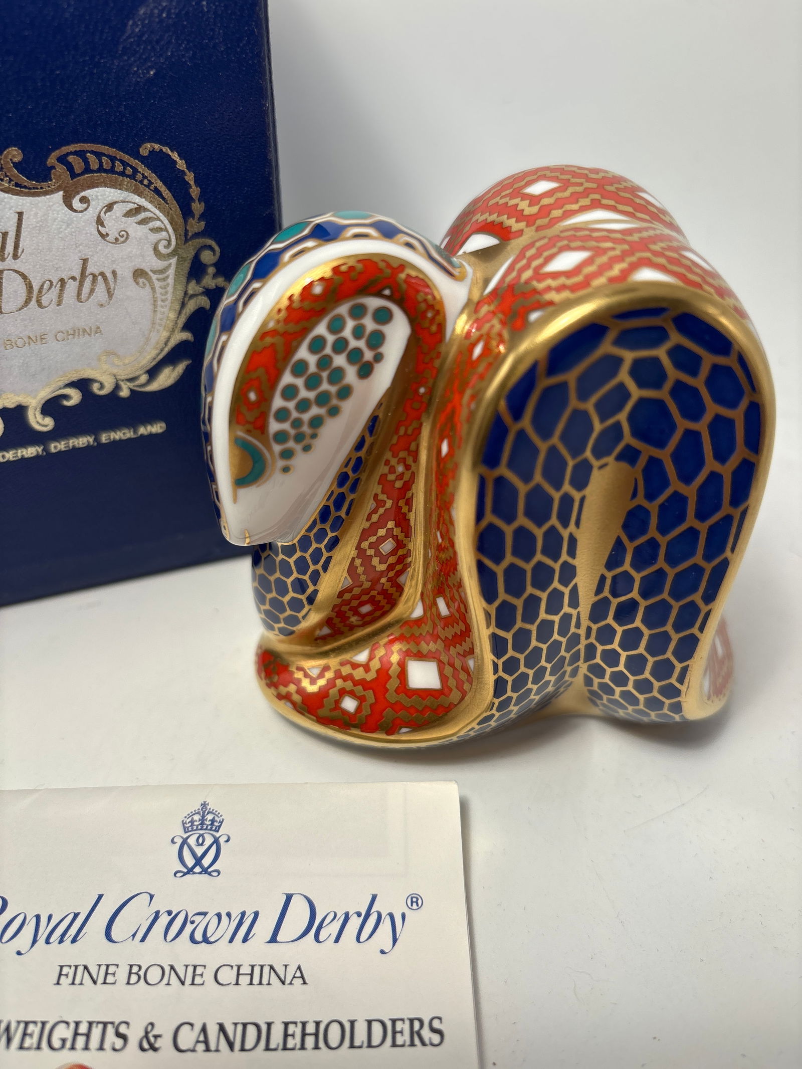 Imari Snake form Royal Crown Derby 3x4 inch paperweight statue: Imari Snake form Royal Crown Derby 3x4 inch paperweight statue. Original box. Silver stopper.Very good condition, no chips, cracks, etc.