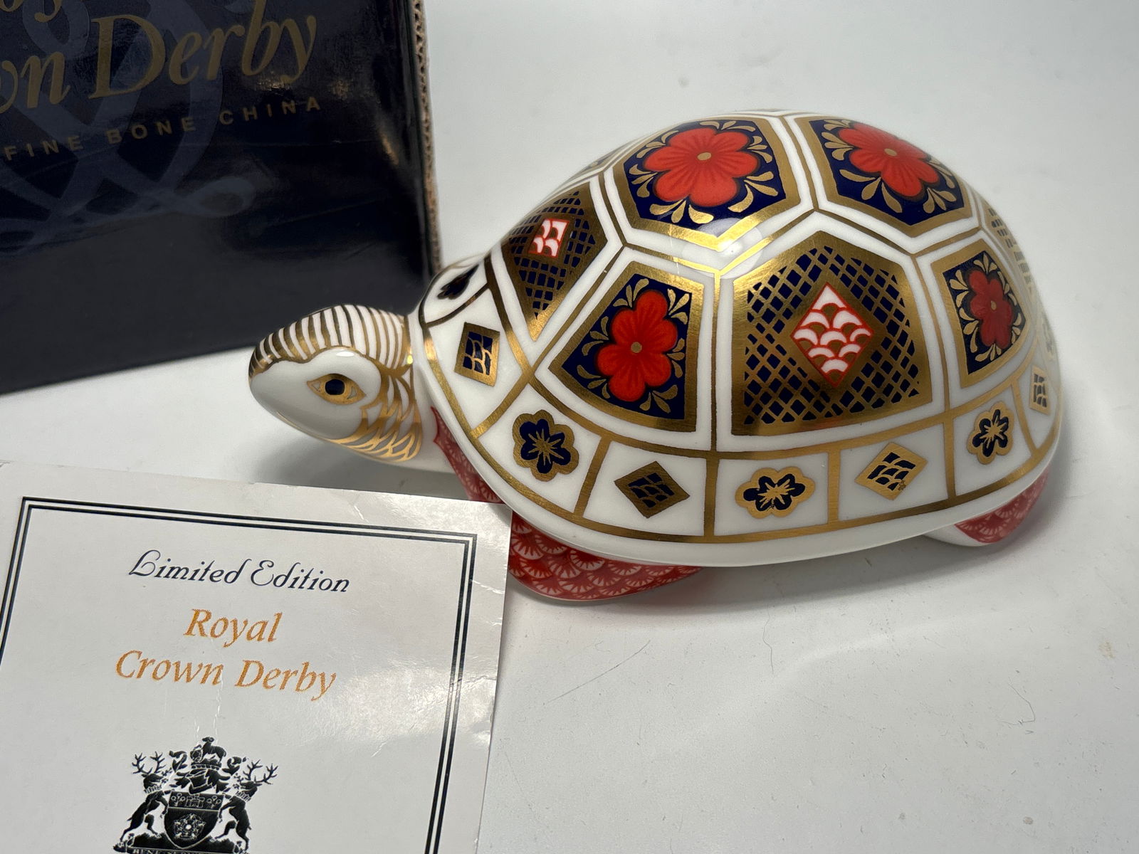 Imari turtle Royal Crown Derby fine China 4&1/2inch paperweight statue: Imari turtle Royal Crown Derby fine China 4&1/2inch paperweight statue. Silver stopper. Original box.Very good condition, no chips, cracks, etc.