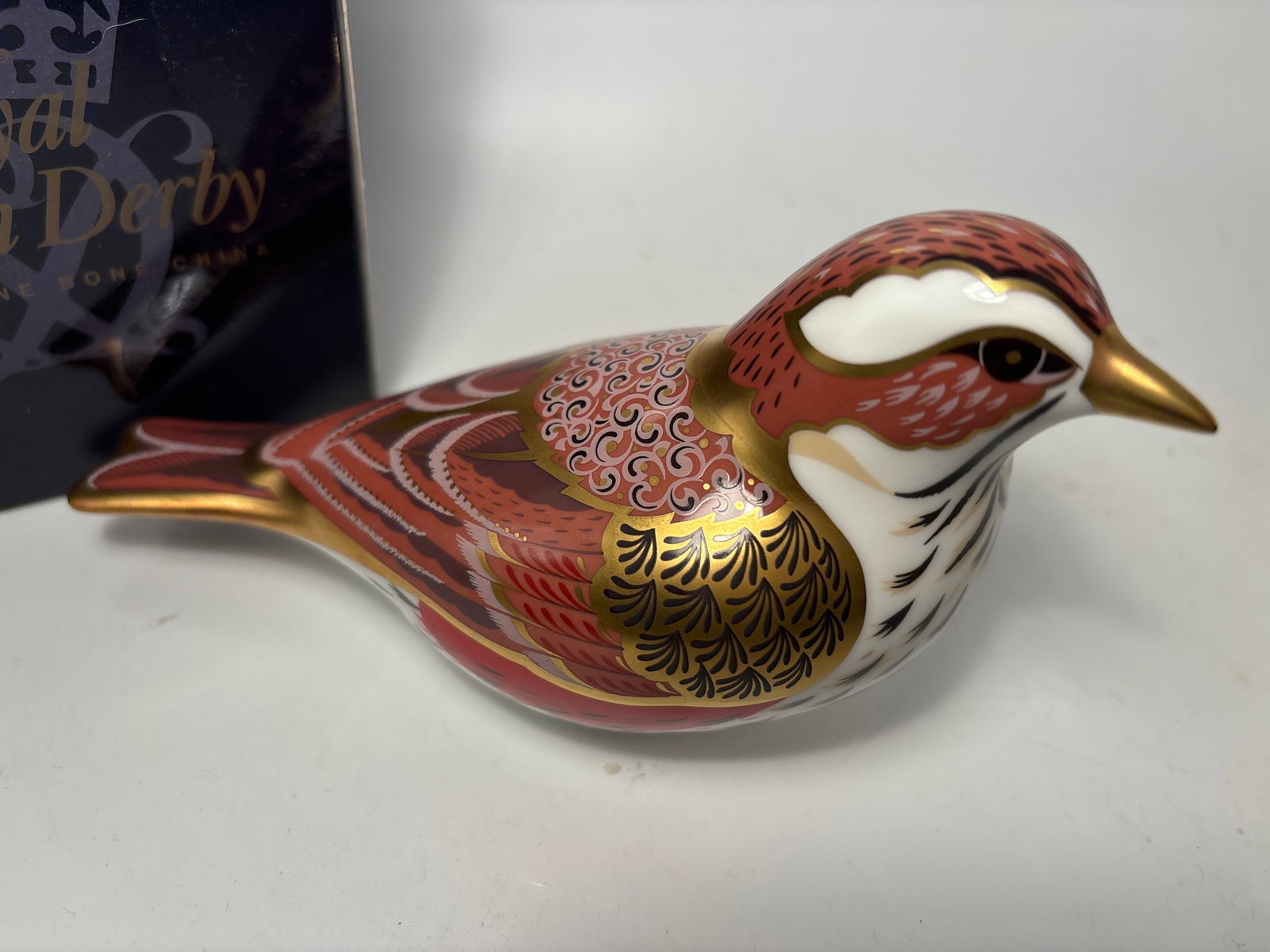 Gorgeous 2011 Collectors Guild Redwing 6 inch Crown Derby fine China paperweight: 2011 Collectors Guild Redwing 6 inch Crown Derby fine China paperweight Original box. Gold stopper.Very good condition, no chips, cracks, etc.