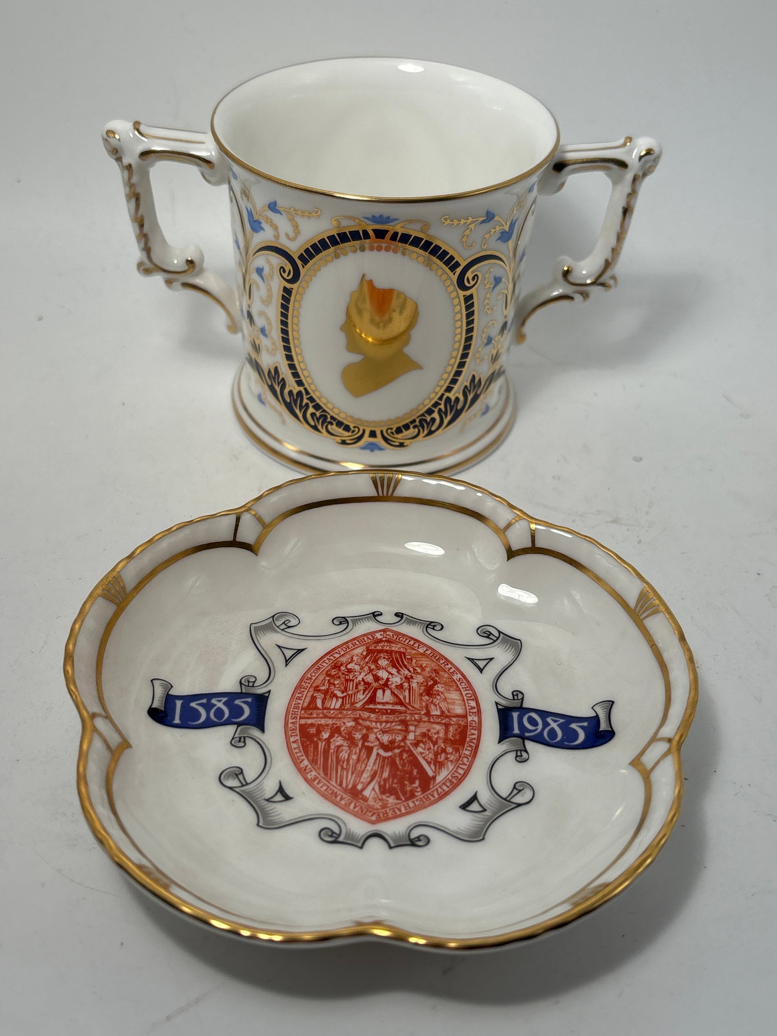 Queen Elizabeth birthday loving cup & commemorative dish Royal Crown Derby: Queen Elizabeth birthday loving cup & commemorative dish Royal Crown Derby fine China 3inch high by wide (not including handles). Very good condition, no chips, cracks, etc.