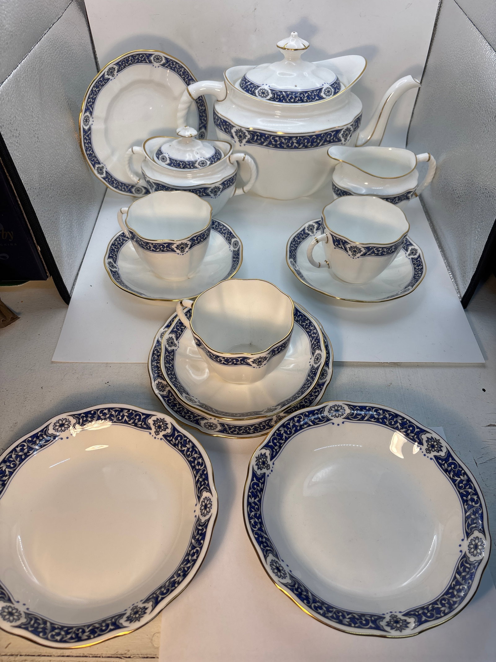 13 piece ‘Milldale’ A1326 Royal Crown Derby English fine china tea set: 13 piece “Milldale” A.1326 pattern Crown Derby English fine china tea set . Covered teapot is 7” high by 11”. Creamer & Covered sugar is 4&1/2” by 5”. Three 2&1/2&rdquo