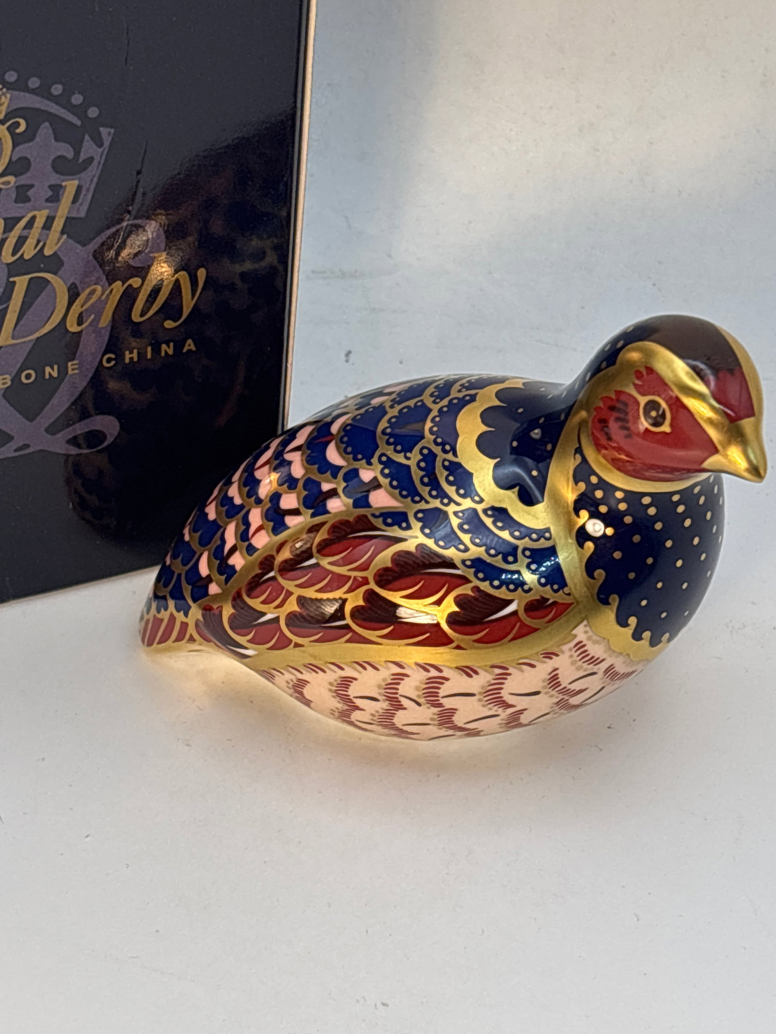 Artist signed limited edition Quail bird Royal Crown Derby English china 3&1/2 inch paperweight: Artist signed limited edition Quail bird Royal Crown Derby English china 3&1/2 inch paperweight .gold stopper. With box.No chips, cracks, repairs…Very good condition