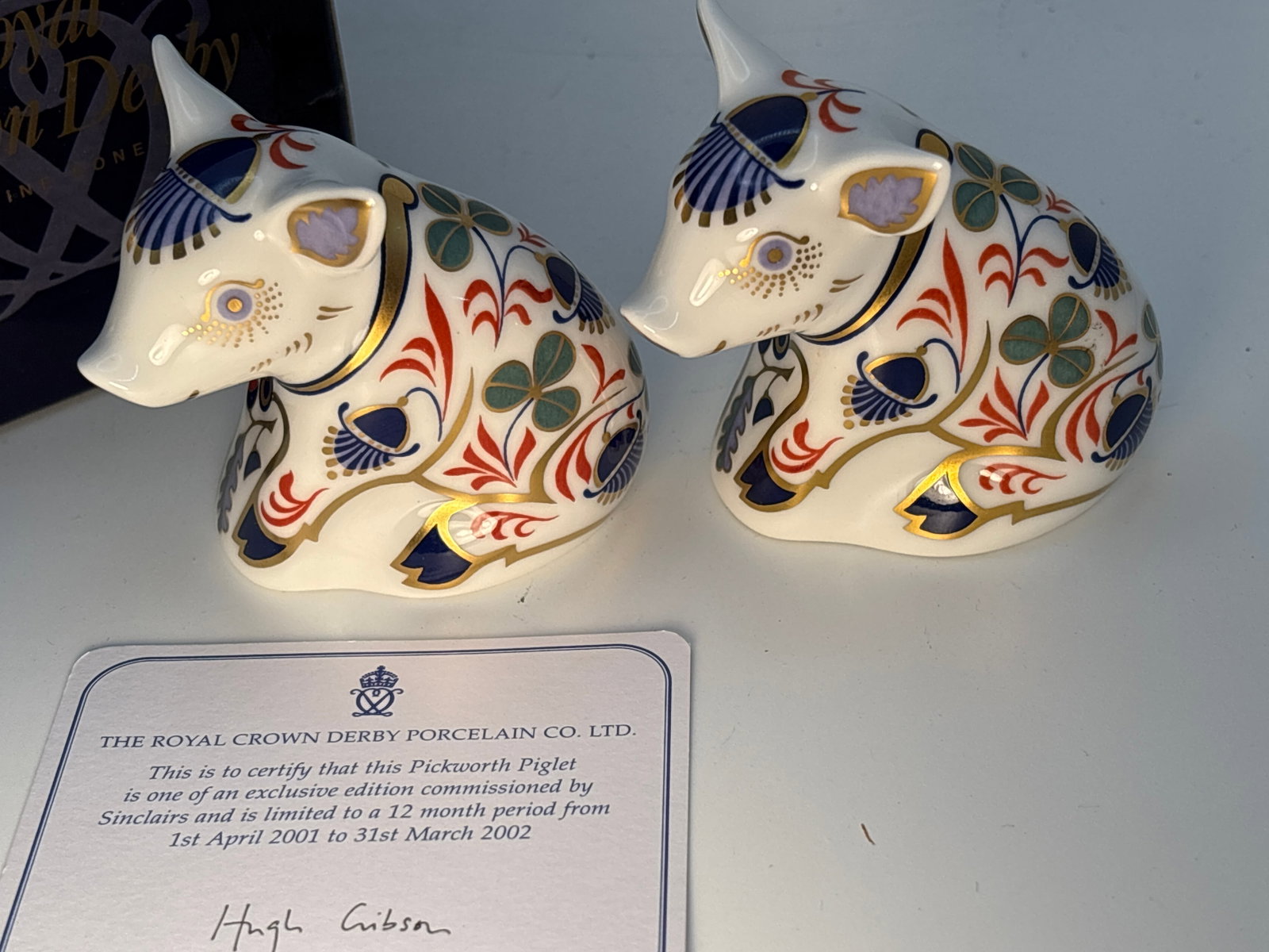 Two Sinclairs exclusive edition Pickworth Piglet Royal Crown Derby 3 inch paperweights: Two Sinclairs exclusive edition Pickworth Piglet Royal Crown Derby 3 inch paperweights.One gold & one silver stoppers. Only one with box and certificate..Very good condition with no chips, cracks, lin
