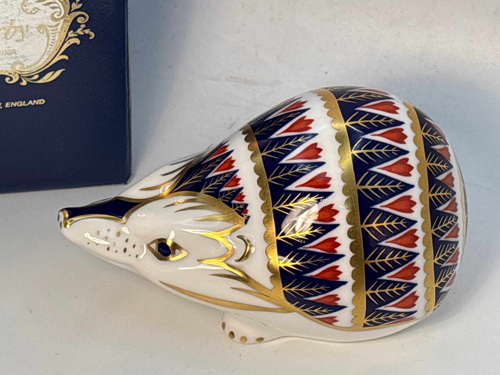 Imari Hedgehog Royal Crown Derby Fine china 4&1/2inch paperweight: Hedgehog’ Royal Crown Derby 4&1/2 paperweight. Silver stopper. With box.Very good condition; no chips, cracks, etc