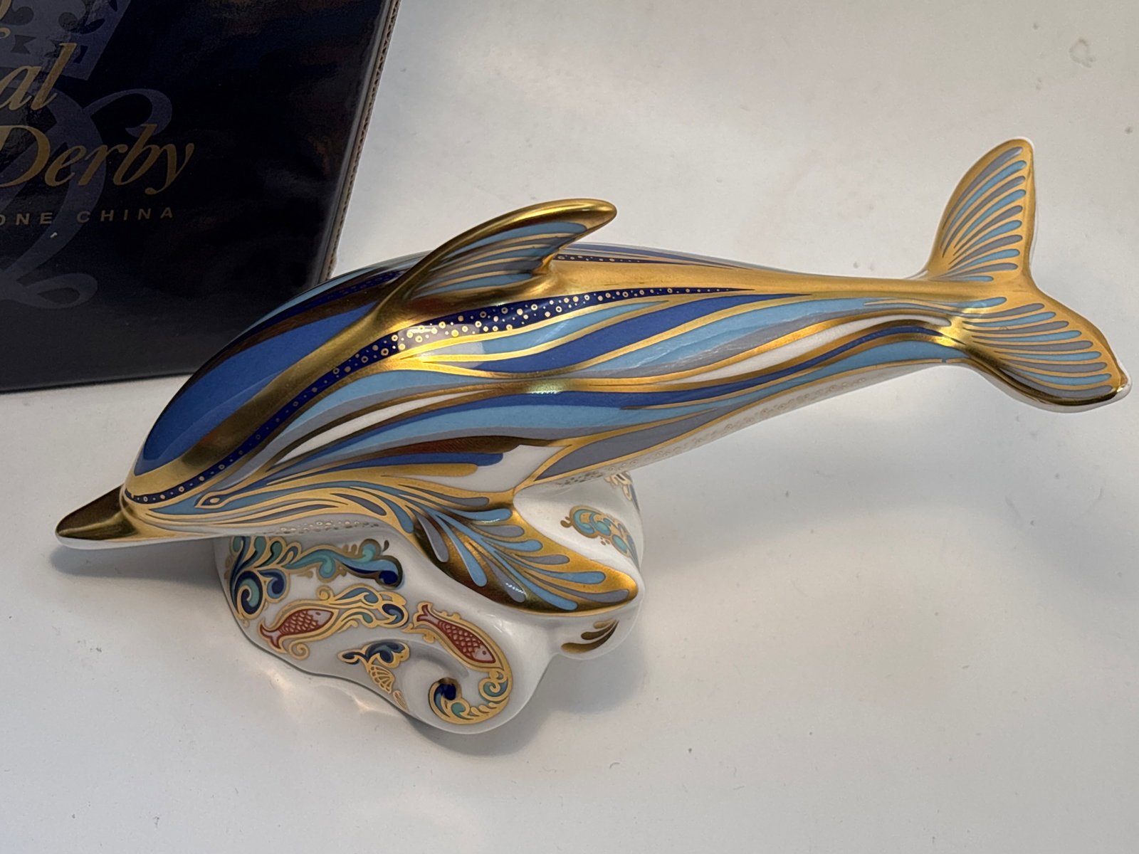 Artist signed 1999 Connaught House signature edition ‘Striped Dolphin’ Royal Crown Derby: Artist signed signature edition ‘Striped Dolphin’ Royal Crown Derby 7&1/2inch paperweight.Gold stopper. With box.Very good condition; no chips, cracks, etc